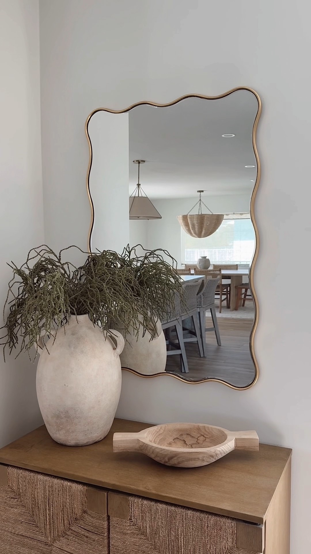 Added this pretty woven cabinet to my small cornered entry + a beautiful wavy scalloped mirror. Filled the corner without making it busy and now we have a place to store shoes and a catch all for a functional and pretty entryway 🤍

#smallentryway #entrywaycabinet #cabinet #wovencabinet #nathanjames #homedepot #target #walmart #homedecor #homefind #entryway #mirror #vase #beschhouse #coastal

#LTKWatchNow #LTKSaleAlert #LTKHome