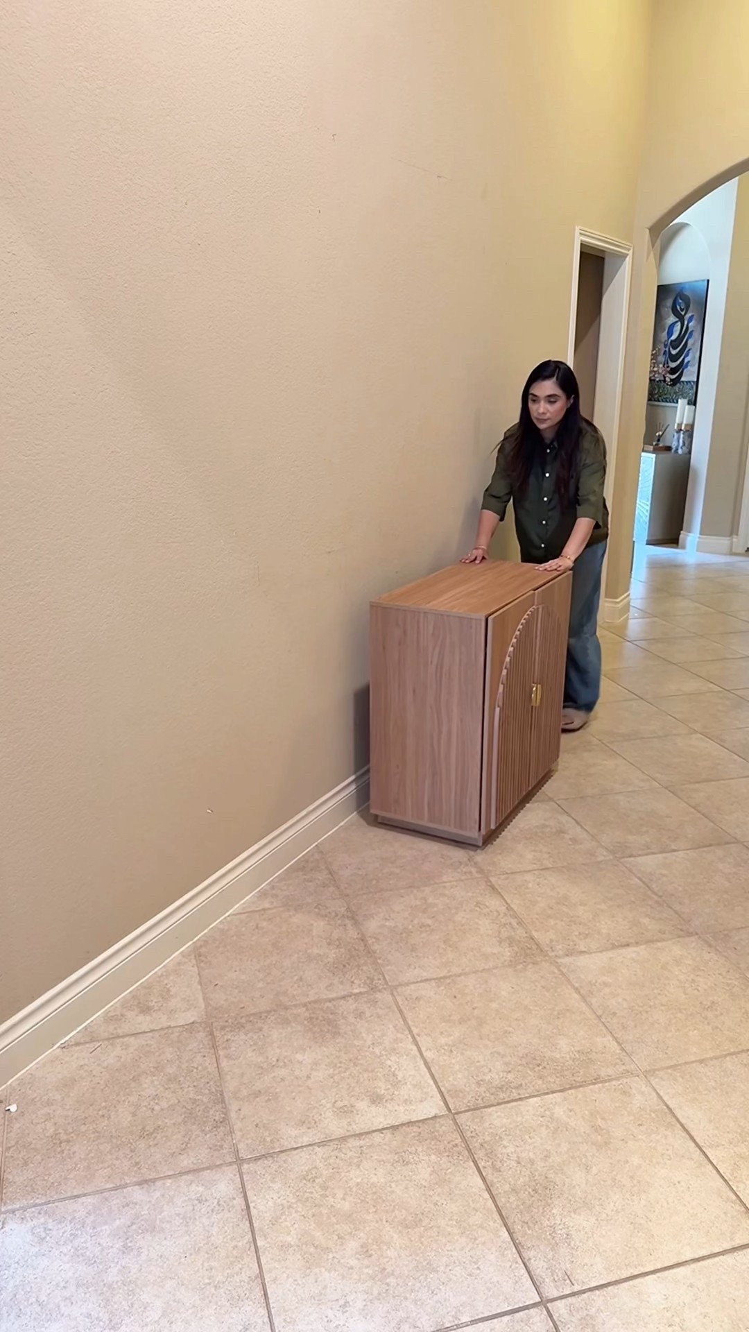 Created a gallery wall with 12 of our favorite family photos framed in clean black frames. To ground the space, I styled 3 fluted cabinets side by side to give to look of a long credenza. Added battery operated picture lights, peonies, and a few coffee table books for layered, timeless styling  

#LTKootd #LTKmomlife #LTKHome