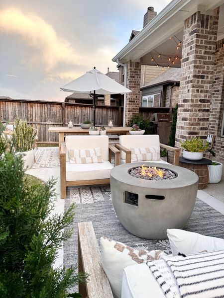 Outdoor living space with fire table 

#LTKSeasonal #LTKhome #LTKstyletip