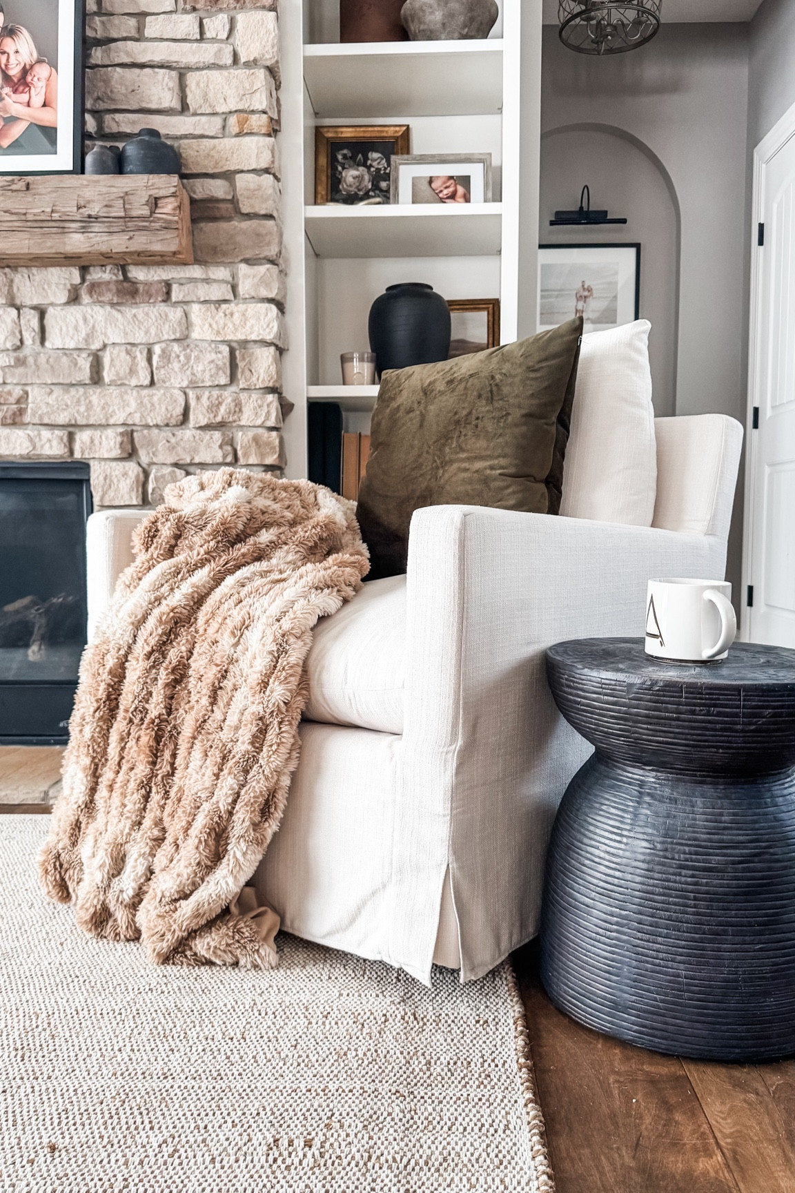 Cozy reading spot. Fur blanket, black side table, velvet pillow, white chair, accent chair, nook, coffee mug

#LTKStyleTip #LTKHome