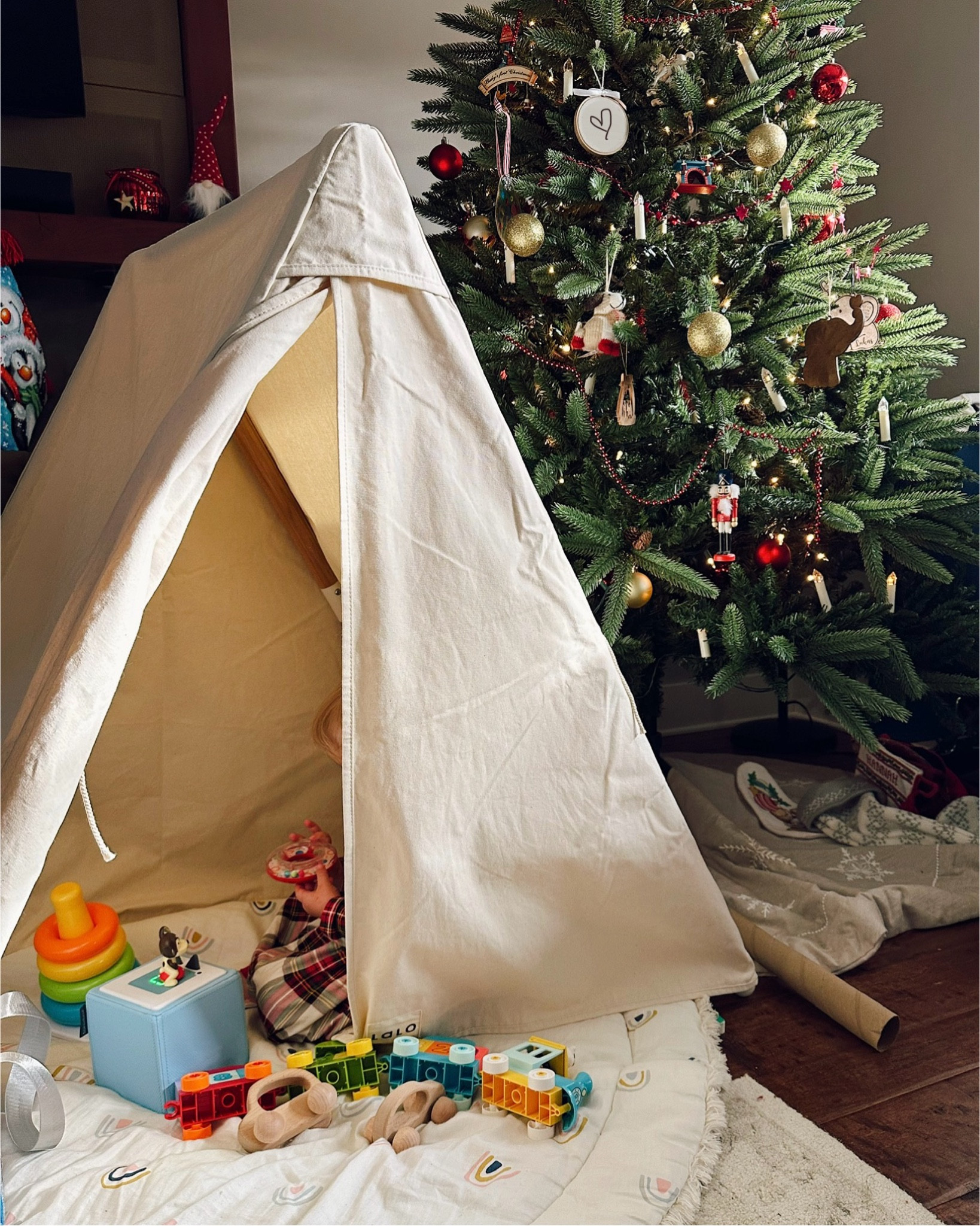 Christmas with a 22-month old was so special. Here are a few of her favorite gifts she received! These would also make great 2nd birthday gifts for a toddler.

The Toniebox was for sure the big winner—she loves the starter puppy Tonie it came with that plays classic songs, and we got a few more for her to try out. We also love it because family in Germany could send ones in German for more language learning opportunities!

She’s getting really into building so the Lego Duplo set was the perfect next step. They’re the ideal size and difficulty level for her and we can continue to add more sets as needed.

And lastly, from family we received the Lalo tent conversion kit to transform the play gym we had from them into this adorable tent! She loves hiding away in there and we love having somewhere to keep her toys tucked away.

#LTKBaby #LTKGiftGuide #LTKKids