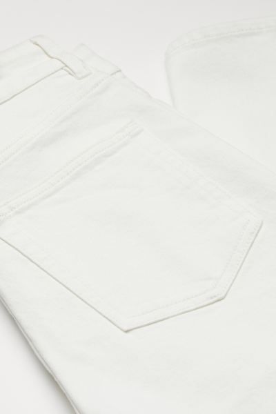 5-pocket, ankle-length jeans in slightly stretchy denim. Extra-high waist, zip fly, and gently ta... | H&M (US + CA)