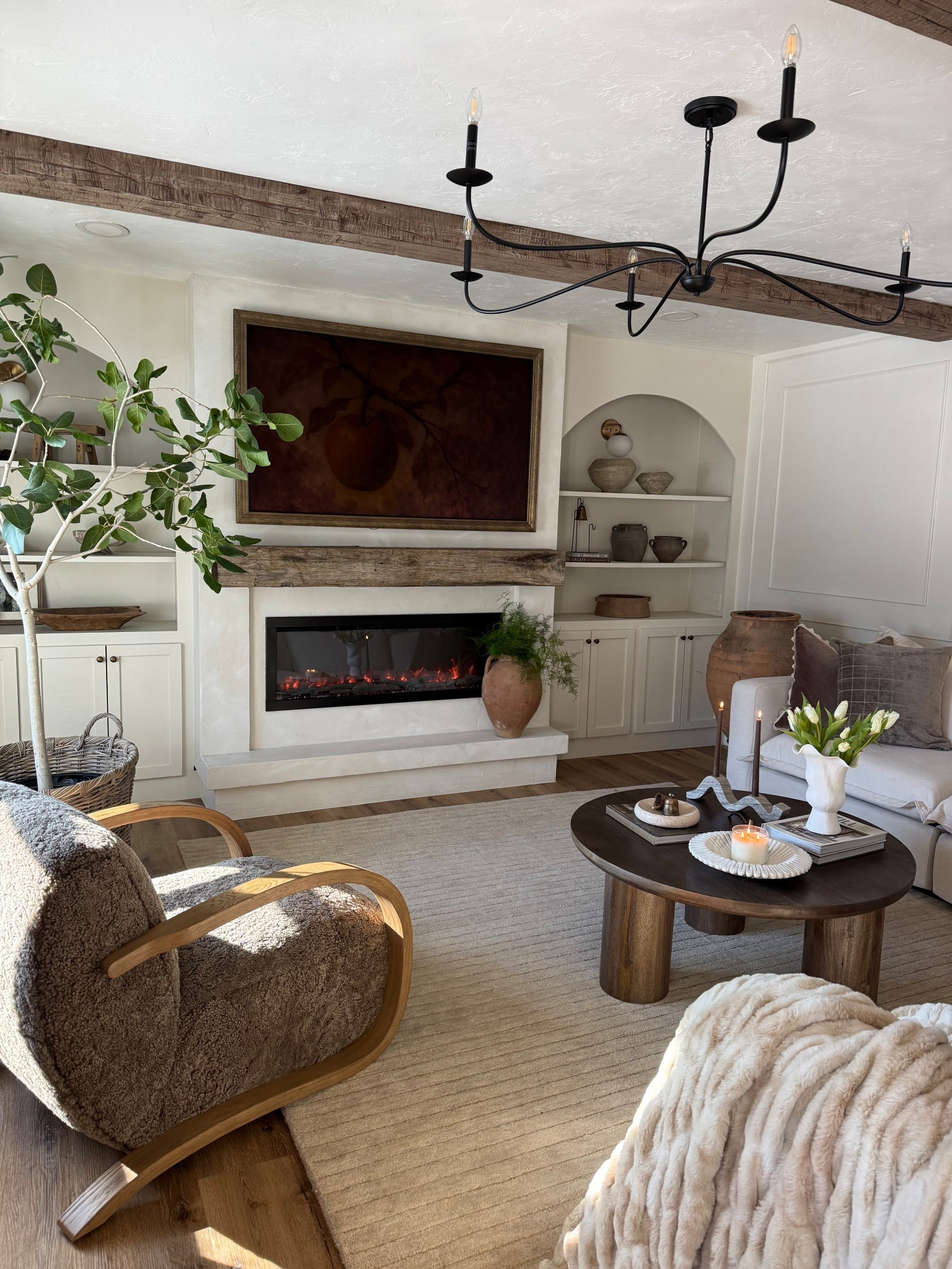 Round coffee table, marble decor, rug, accent chair, chandelier, electric fireplace — all finds from @Wayfair #wayfair #wayfairpartner #ad 

#LTKHome #LTKSeasonal