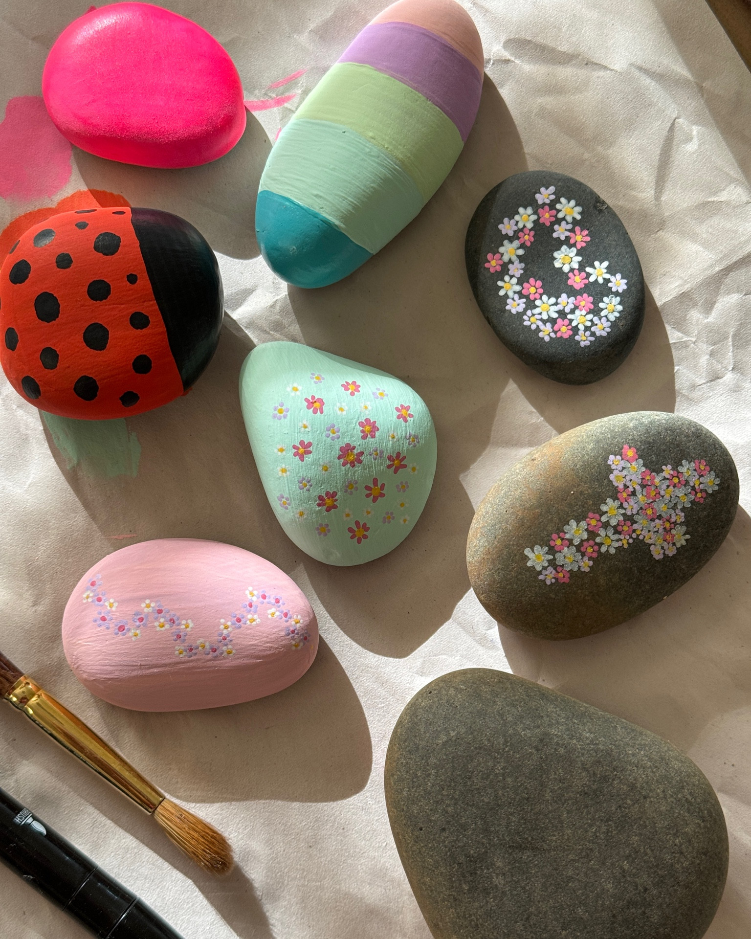 Quick and easy summertime craft! We grabbed some rocks from our garden, some old paints + this new find, acrylic paint pens! 🌸🪨🎨👩‍🎨🌺

#craft #diy #summerart