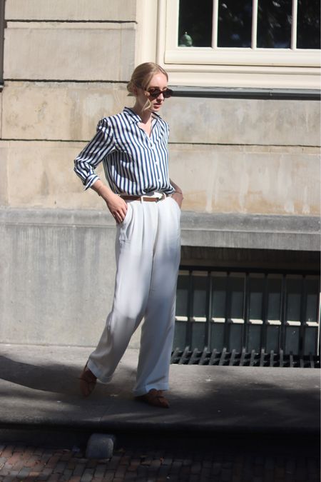 Classic look with striped shirt 

Striped shirt, silk shirt, silk trousers, white trousers, loose trousers, wide leg trousers, brown leather belt, brown belt, brown loafers 

#LTKstyletip #LTKeurope #LTKSeasonal