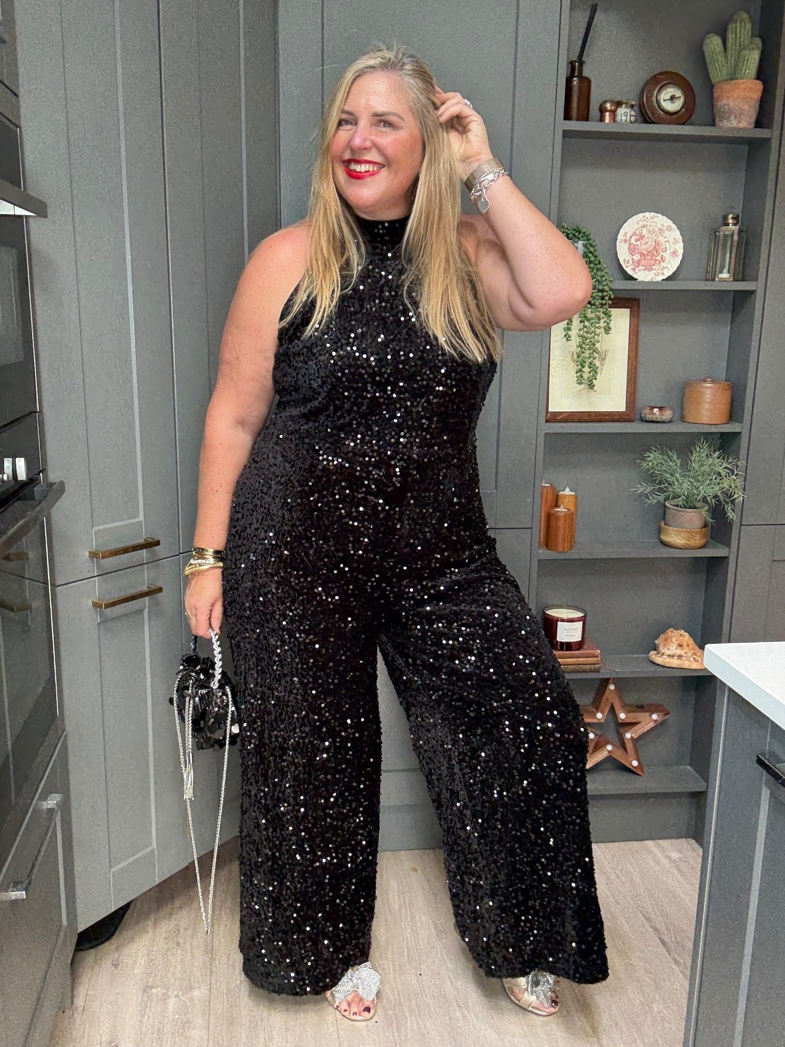 Sequin jumpsuit, gold heels, black sequin bag 

#LTKpartywear #LTKfestive #LTKplussize