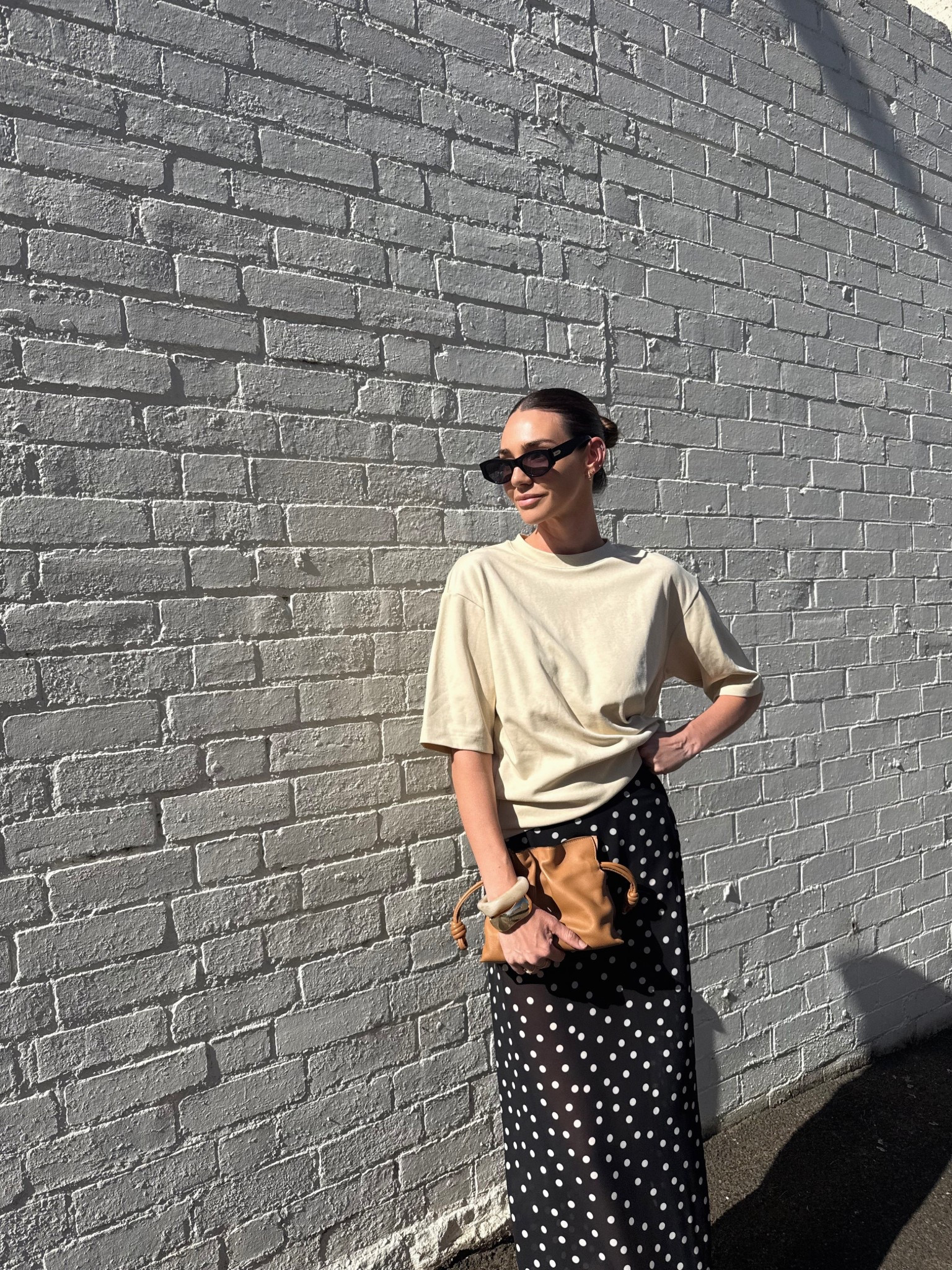 Polka dot sheer maxi skirt 
Oversized beige tee 
Black sunglasses 
Tan leather bag 

#LTKaustralia #LTKsummer #LTKstyletip