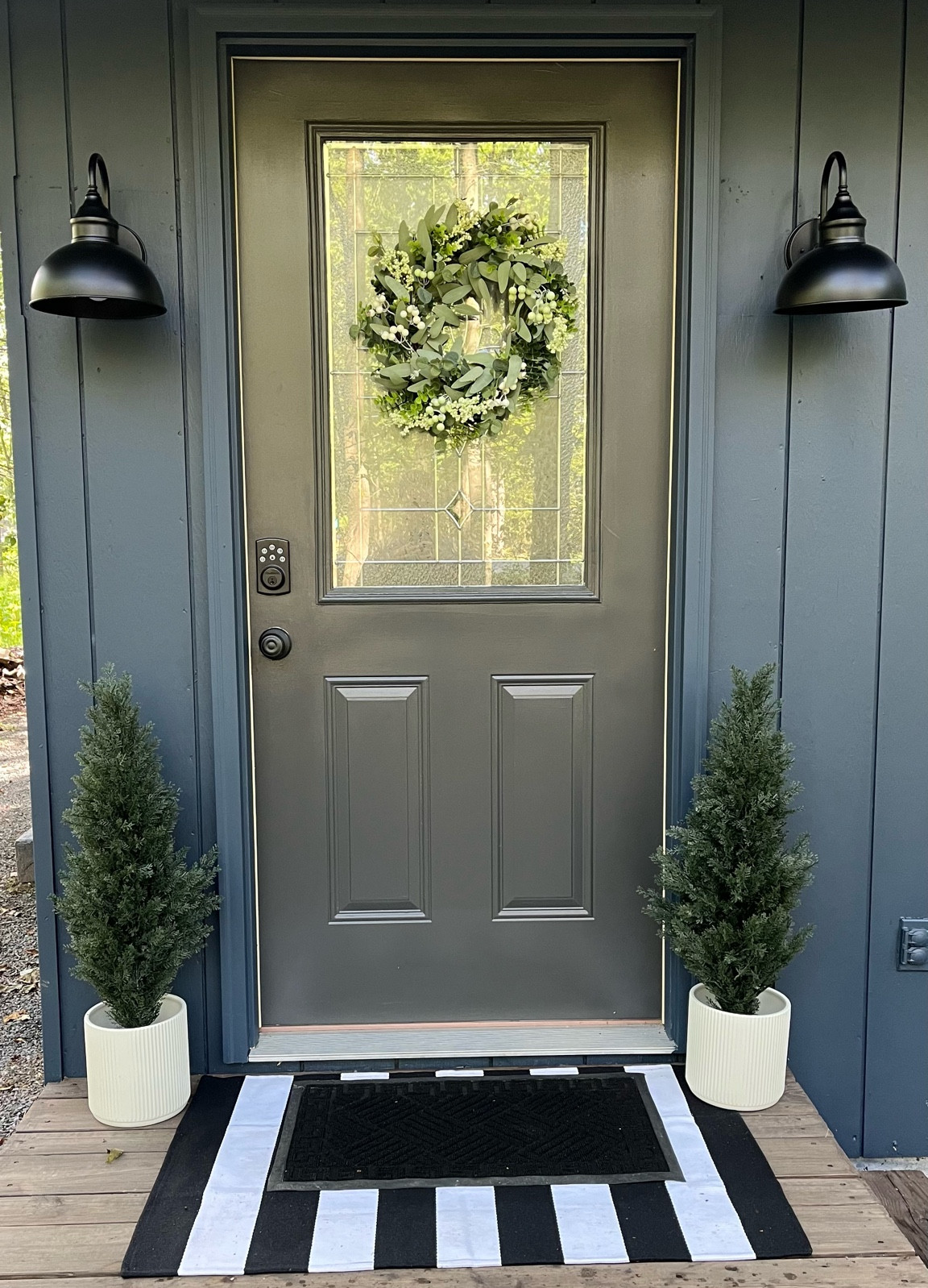 It’s a front porch refresh!🪴🏡 

We added two new exterior lights, a striped rug, a door mat, two planters with (artificial 🤫) plants, and a wreath on the door.

#LTKSeasonal #LTKHome #LTKFamily