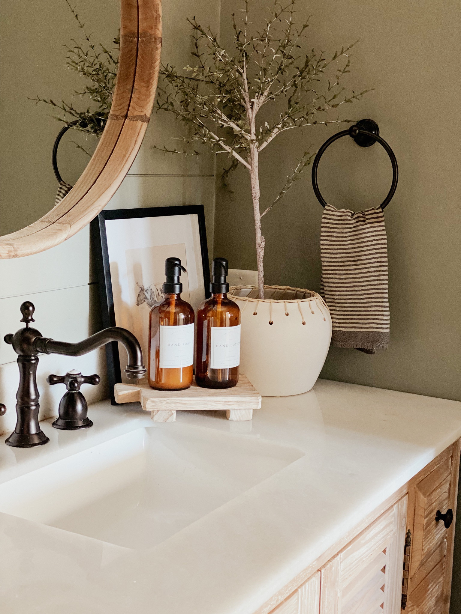 Powder bathroom decor, bathroom inspo, countertop decor, Amber soap dispenser, framed art, faux plant, Amazon home decor, target home decor

#LTKstyletip #LTKhome #LTKSeasonal