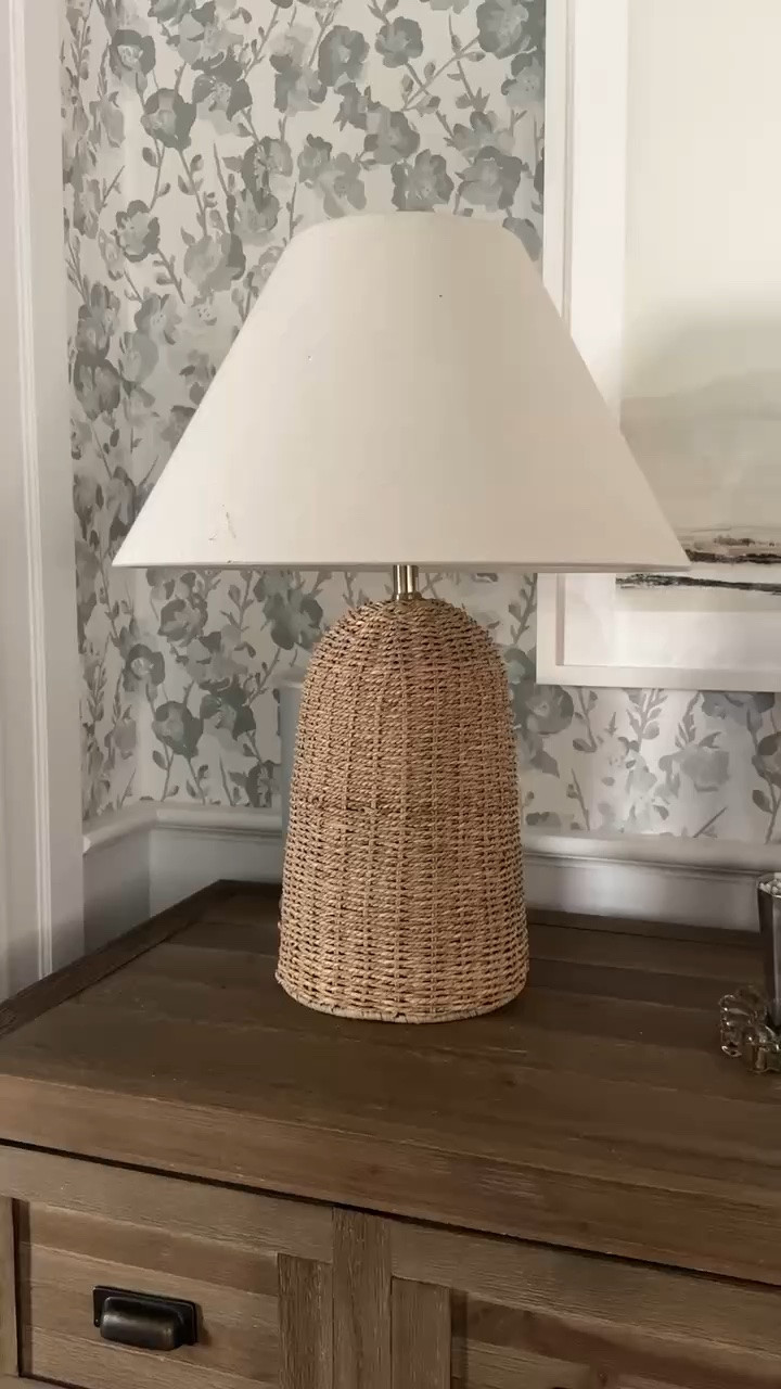 This woven table lamp is such a beautiful way to bring warmth and texture into a room. I love the natural woven base paired with the classic linen shade, especially against the floral wallpaper and warm wood.

woven table lamp, rattan lamp, natural texture decor, table lamp, bedroom lighting, living room lighting, coastal home decor, neutral home decor, fall home styling, classic home decor, warm lighting, girlonthehudson