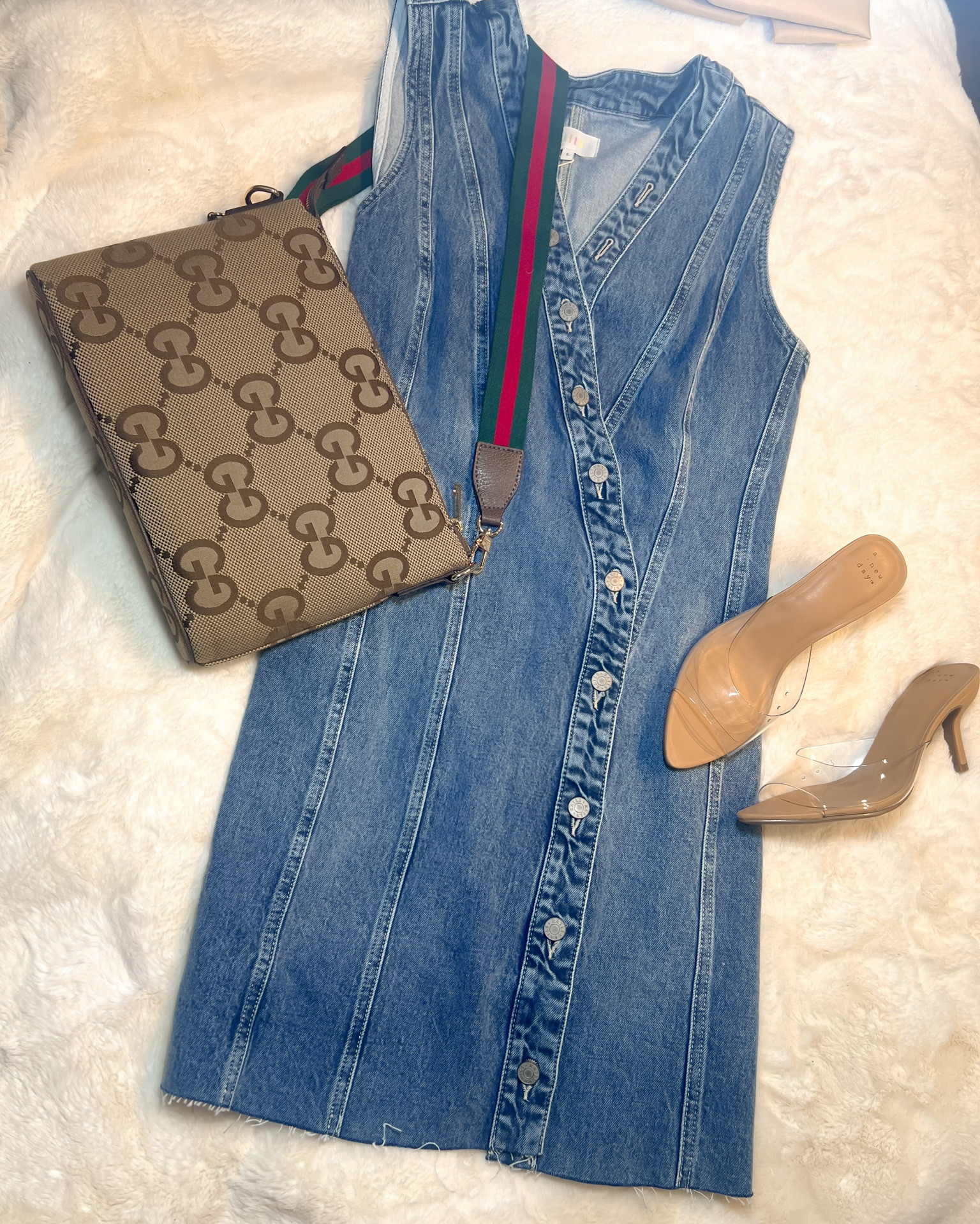 It’s a little too cold and I’m a lot too pale to put this dress on right now. But, I had to show you guys! This denim dress is asymmetrical with a raw hem.  It’s is a sleeveless  with a vneck. The dress does run small, I went from an M to an L, however the material has a good amount of stretch to it. It even arrived in its own dust bag! 
Perfect spring dress, beach vacation, denim , date night, Gucci, heels , high heel sandals, clear heels, Cinderella shoes 

#LTKstyletip #LTKitbag #LTKSeasonal