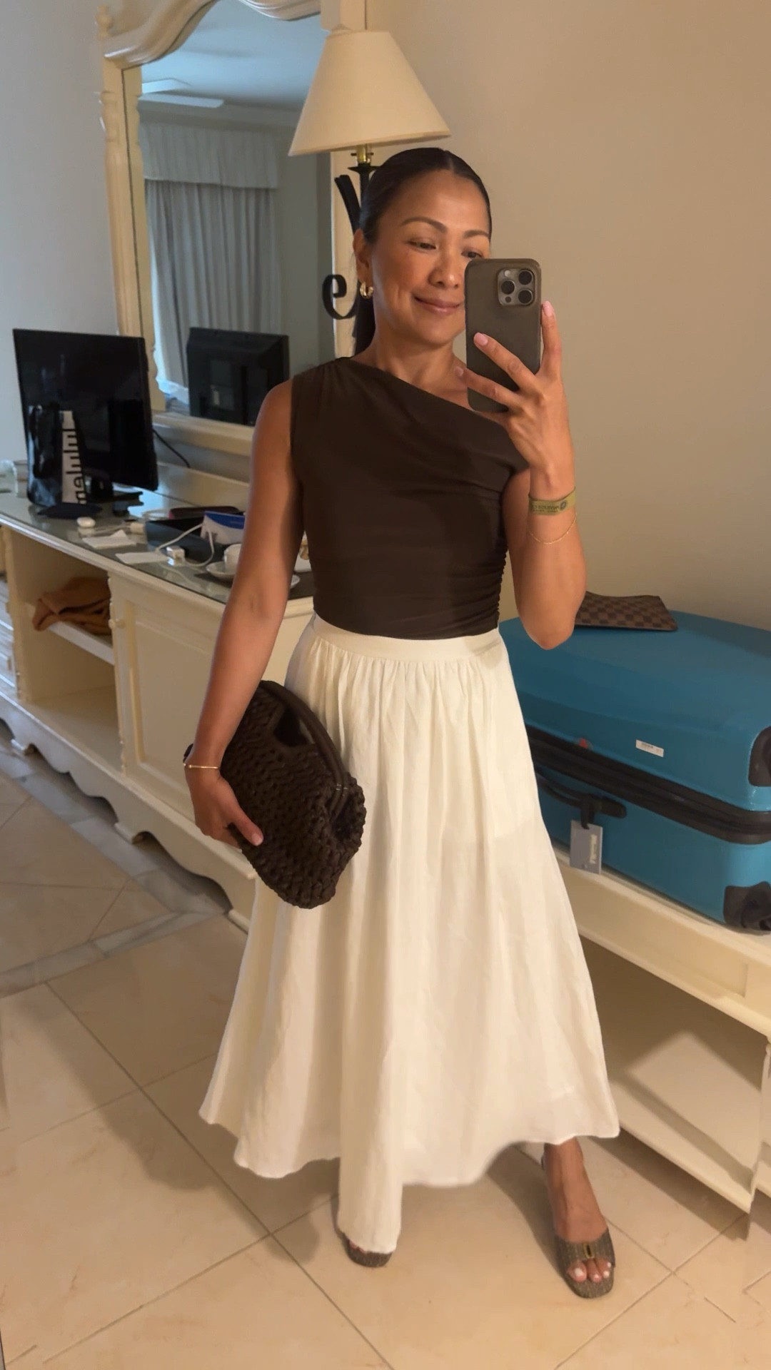 White linen skirt, brown top, brown raffia clutch 

#LTKsummer #LTKpartywear #LTKcanada