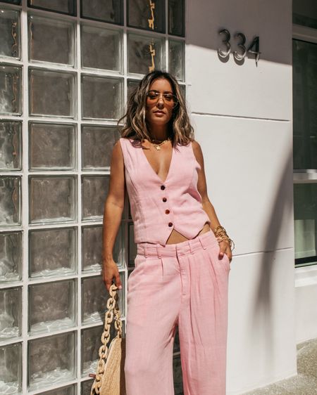An HR nightmare bc this styling is my literal idea of business casual 🌸 Lspace Rhodes Pant & Vest in the color | Macaroon Pink | A cotton + linen set that is ready to wear. The vest has functional buttons & the pants are straight leg w/ pleats but have a relaxed + slouchy fit (aaand pockets!) 

Rhodes set paired w/ Sezane Natural Woven Raffia Isabelle HandBag 🎀 Lu Goldie | Amelia in Crme Brulee on Revolve ✨Scent is Yves Saint Laurent Black Opium 🤌🏼 #springoutfit #workwear #styling #pinkset #linenpants #businesscasual 

xx - Rachael 

#LTKworkwear #LTKSeasonal #LTKstyletip