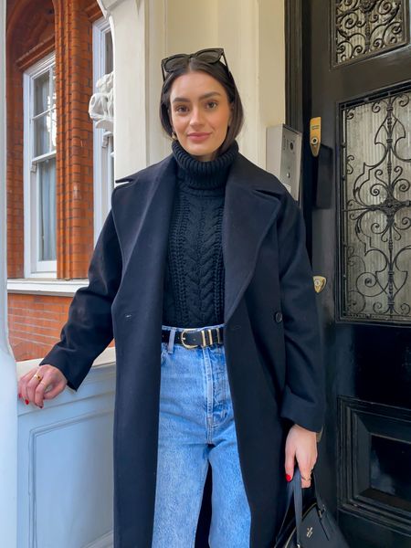 Black coat, cable knit jumper, lightwash blue jeans high waist wide leg 

#LTKSeasonal