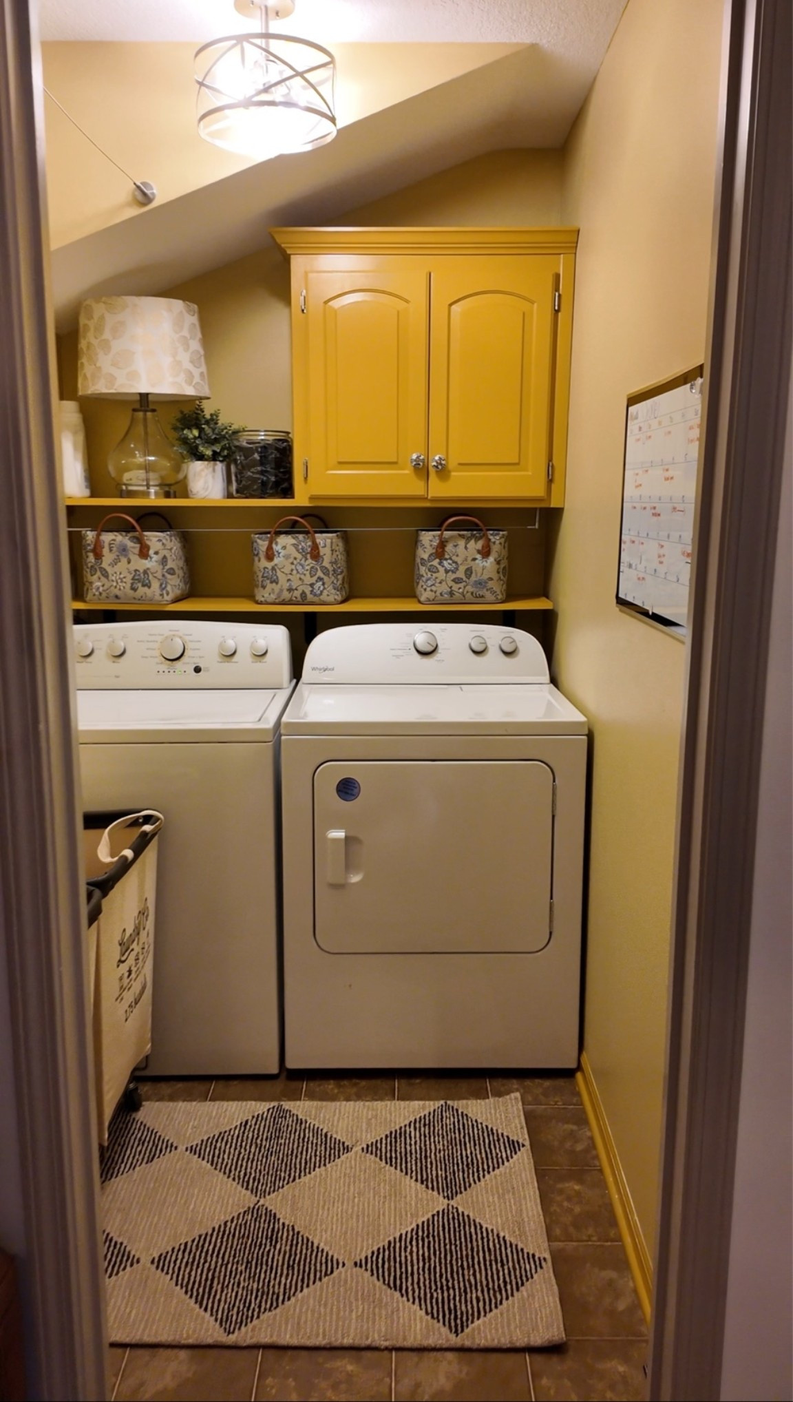 Laundry room floral baskets + geometric patterned rug