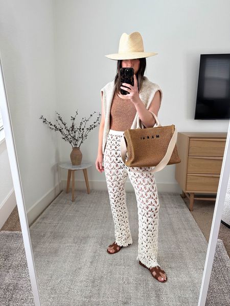 Neutral resort wear. Petite vacation looks. Really love these crochet pants. Work on petites. Also, the Hunza G square neckline is the one I’d recommend. More support and less revealing. 

Hunza G one piece
Capitanna cover up pants xs/s
Everlane linen blend sweater xs (old)
Hermes Oran sandals 35
Marni tote 
Janessa Leone hat small

Sandals, vacation outfit, swim, swimwear, swim style, summer outfit, summer style. 

#LTKSeasonal #LTKswim #LTKtravel