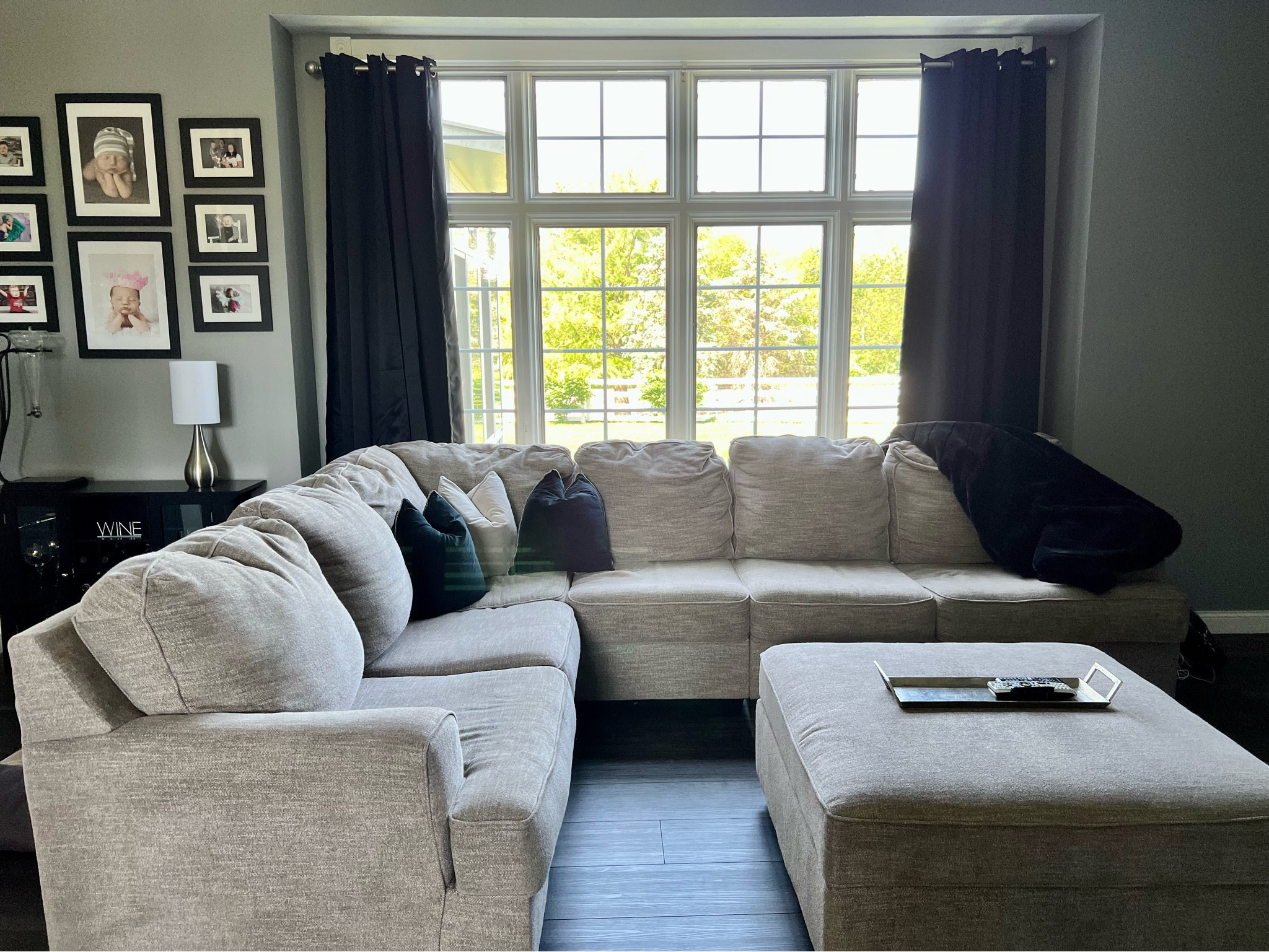 Ashley furniture. Ashley sectional. Sectional couch. Ottoman. Sectional and ottoman. Amazon. Amazon finds. Blackout curtains. Amazon curtains. Wine cabinet. Coffee and wine bar. Black and white picture frames. Table lamps. Wine decor. For the home. Living room. Living room curtains. Living room decor. LTK finds. 

#LTKstyletip #LTKFind #LTKhome