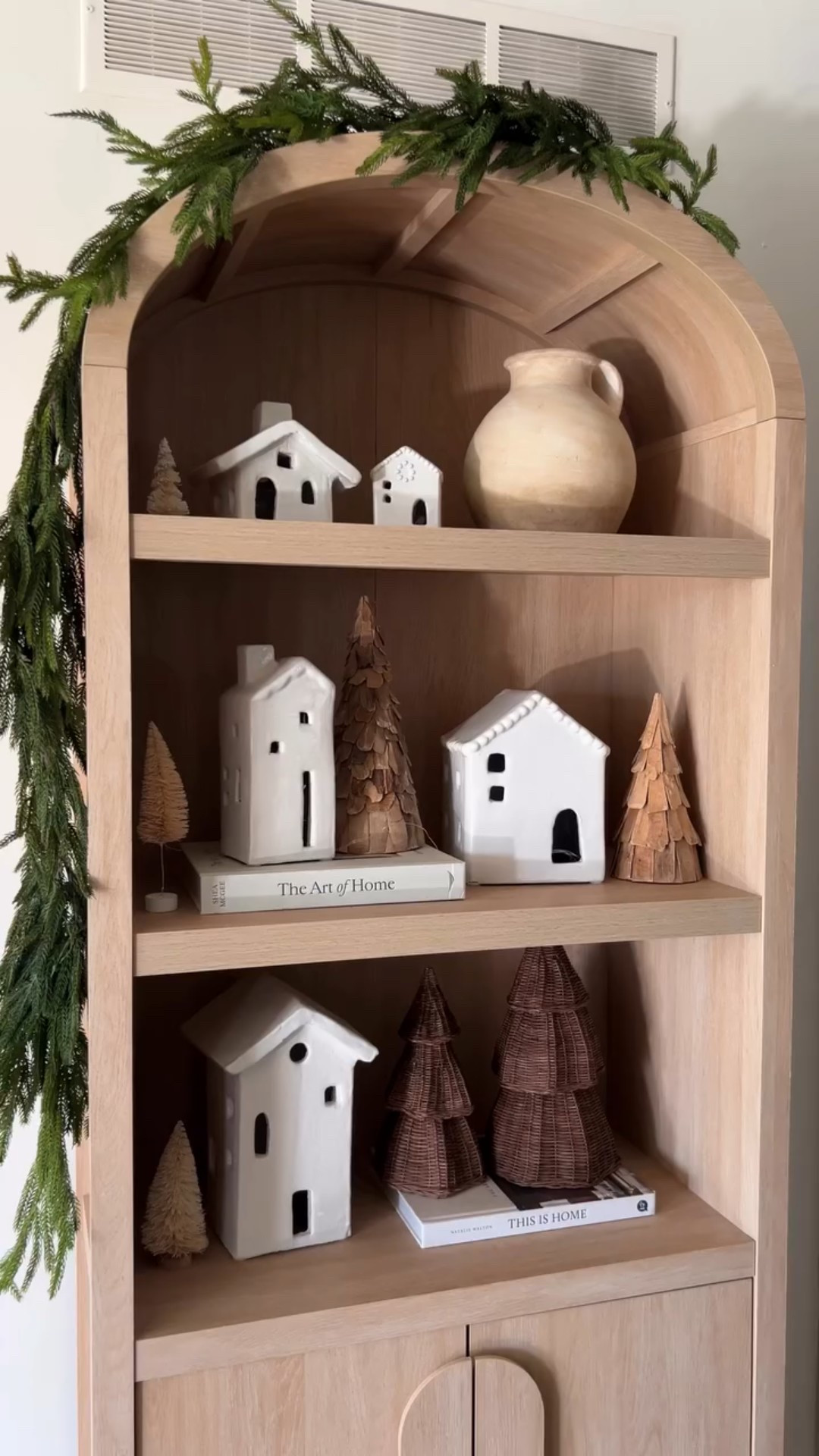 How I styled my arched bookcase for Christmas ✨🎄 simple houses with twinkle lights, trees and Norfolk pine garland draped over the top



#LTKSeasonal #LTKHome #LTKHoliday