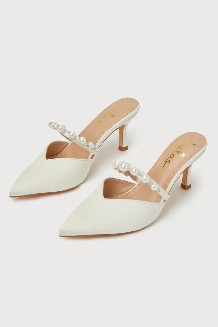 The luminous satin texture and elegant pearl embellishments create a polished, graceful look perfect for bridal showers, receptions, and formal celebrations. Under $60.

Keywords:

* satin mule pumps
* pearl heels
* white pointed toe heels
* bridal shoes
* elegant mule heels
* wedding guest heels
* feminine dress shoes
* satin occasion pumps
* bridal shower outfit
* wedding day accessories
* formal event styling
* European chic fashion
* cocktail party shoes
* elevated feminine style
* evening glamour look
* luxury bridal aesthetic

#LTKgrwm #LTKootd #LTKWedding