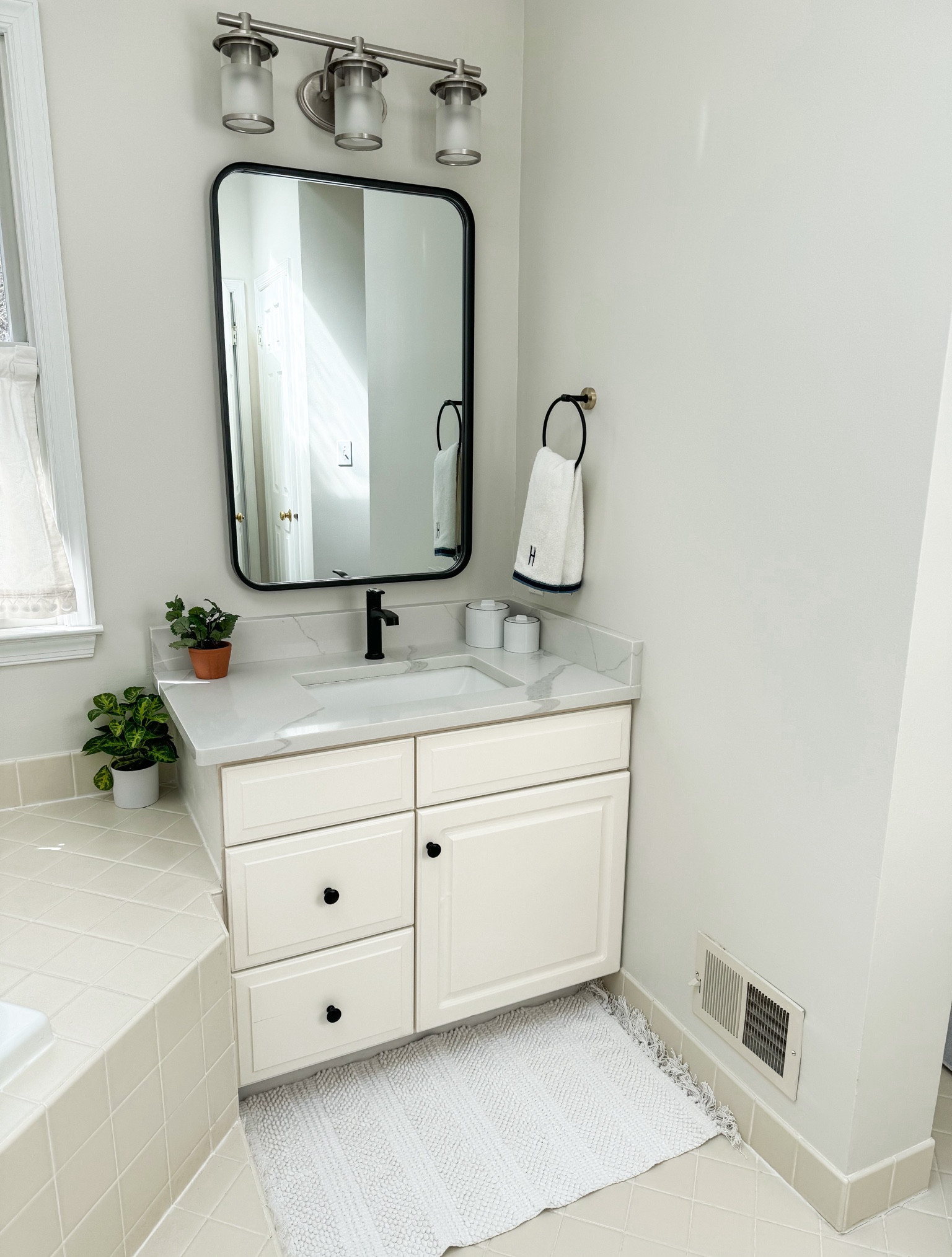 We didn’t redo our master bathroom yet, but made a few simple updates like changing out mirrors, hand towel holders, faucet and counter tops/sink 

#LTKhome