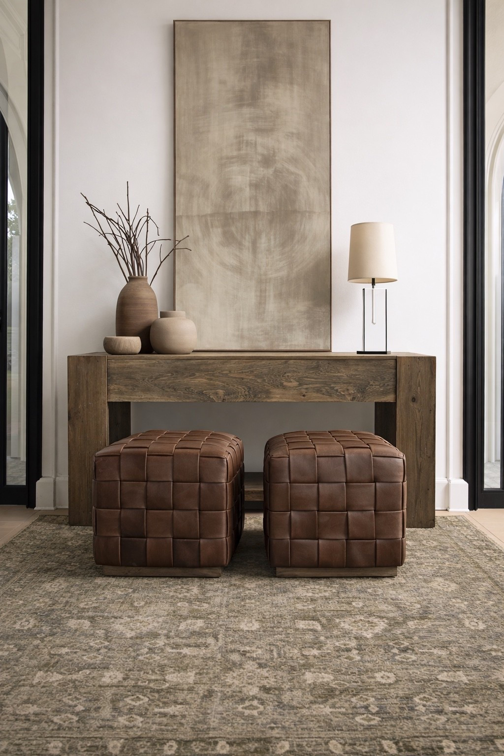 I like spaces like this where nothing is fighting for attention. The wood console, the art, the leather ottomans all work together. Calm, warm, and easy to live with.

leather ottoman, wood console table, neutral home decor, warm neutral home, modern neutral style, layered neutrals, entryway decor, functional furniture, LTK home finds

#LTKSaleAlert #LTKHome