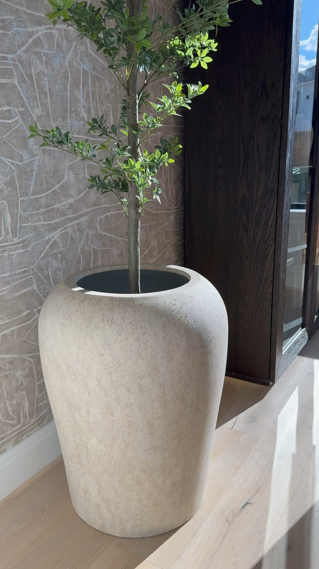 I am absolutely loving this planter from Pottery Barn! It's gorgeous, and the best part is that it's so versatile - it works perfectly for both bigger trees and smaller ones too! 🌳 I love it so much that I actually ended up buying another one, haha! 😆 It's definitely a game-changer for decorating any space. 