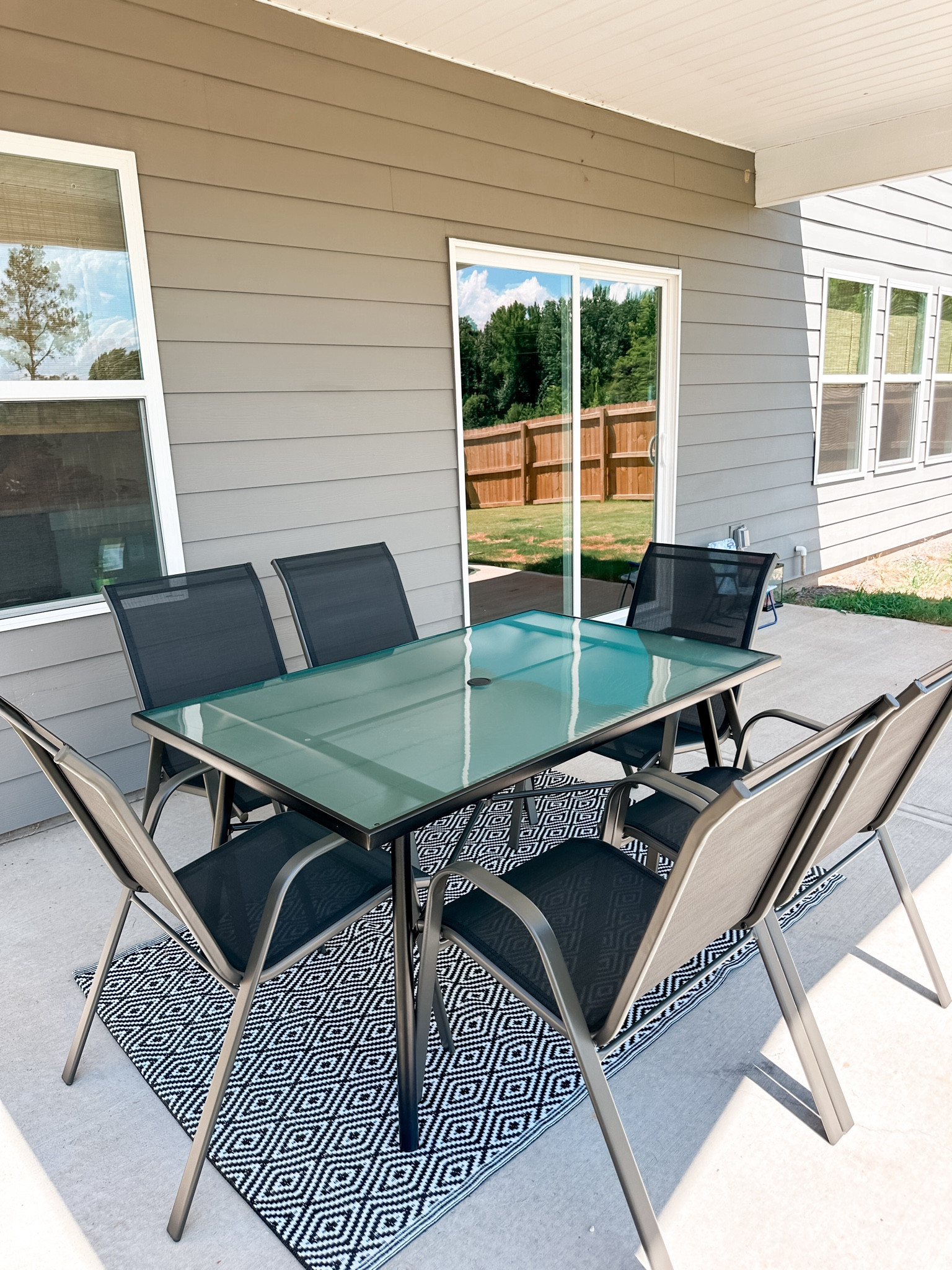 New patio furniture! All of this for our back porch was less than $300 from Target! Patio glass top table, 6 patio chairs, and a black and white rugg

#LTKHome #LTKFindsUnder100 #LTKStyleTip