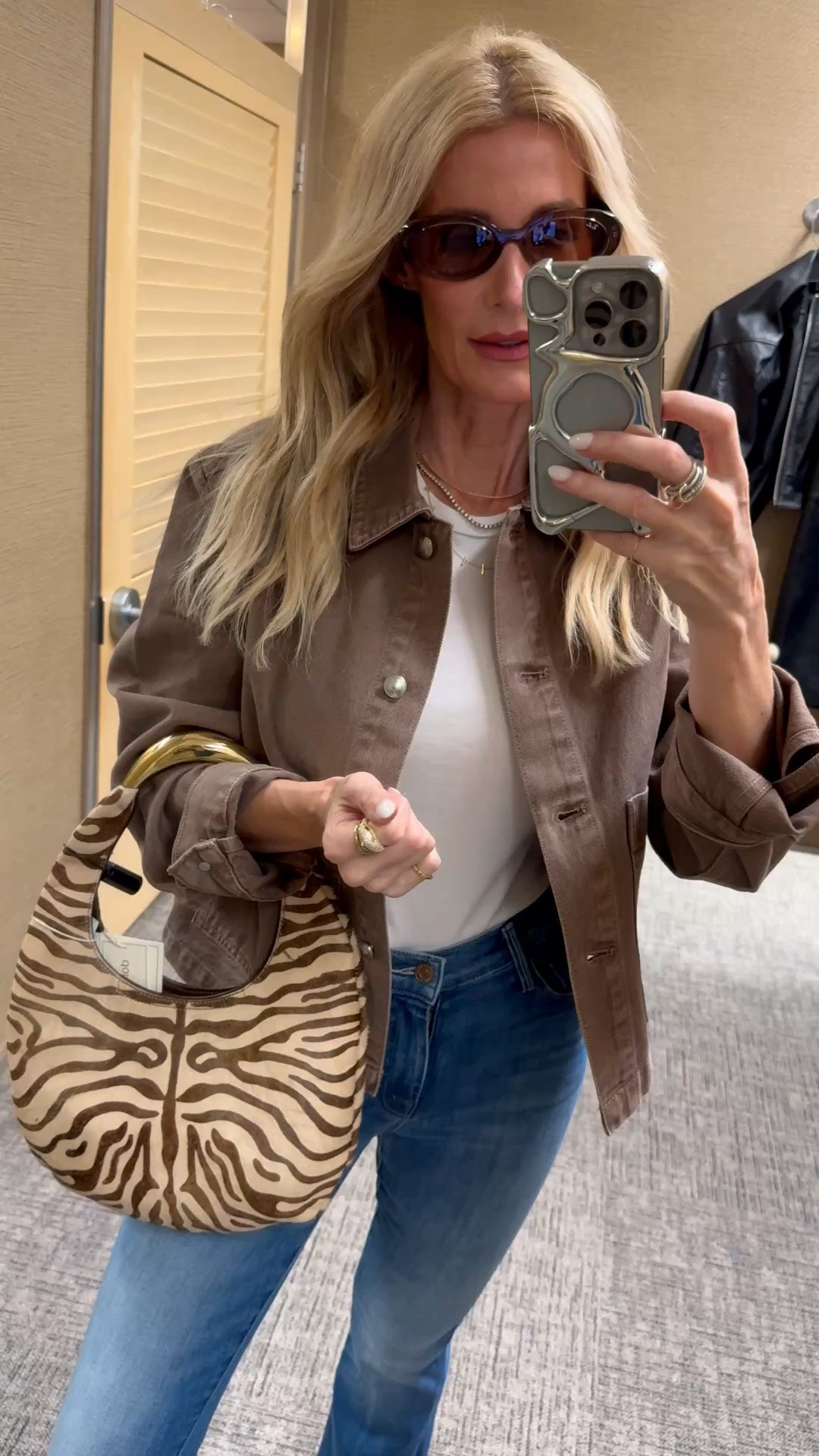 This zebra-print shoulder bag is such a chic statement accessory — I love how it instantly makes a simple brown jacket and denim outfit feel more modern, polished, and intentional. The neutral print is bold but still wearable, making it the perfect handbag to style with fall basics, denim looks, and elevated everyday outfits. I’m wearing an XS in the jacket and a size 24 in the jeans. #LTKOver40 #LTKStyleTip #FallOutfits
 

 #LTKSeasonal #LTKOver40 #LTKSaleAlert