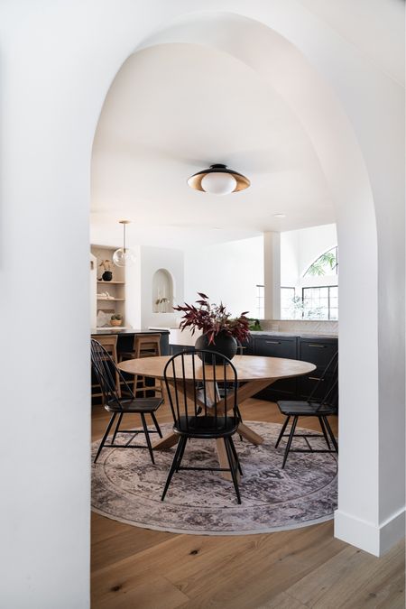 Kitchen + Dining Room Decor

Kitchen with round table, contrasting black dining chairs, black pendant with brass detailing, ruggable rug, black vessel, cook books, and kitchen decor. 

Dine in kitchen, kitchen finds, home decor, kitchen table, dining table. 

 #LTKfind #LTKxWayDay


#LTKFamily #LTKHome