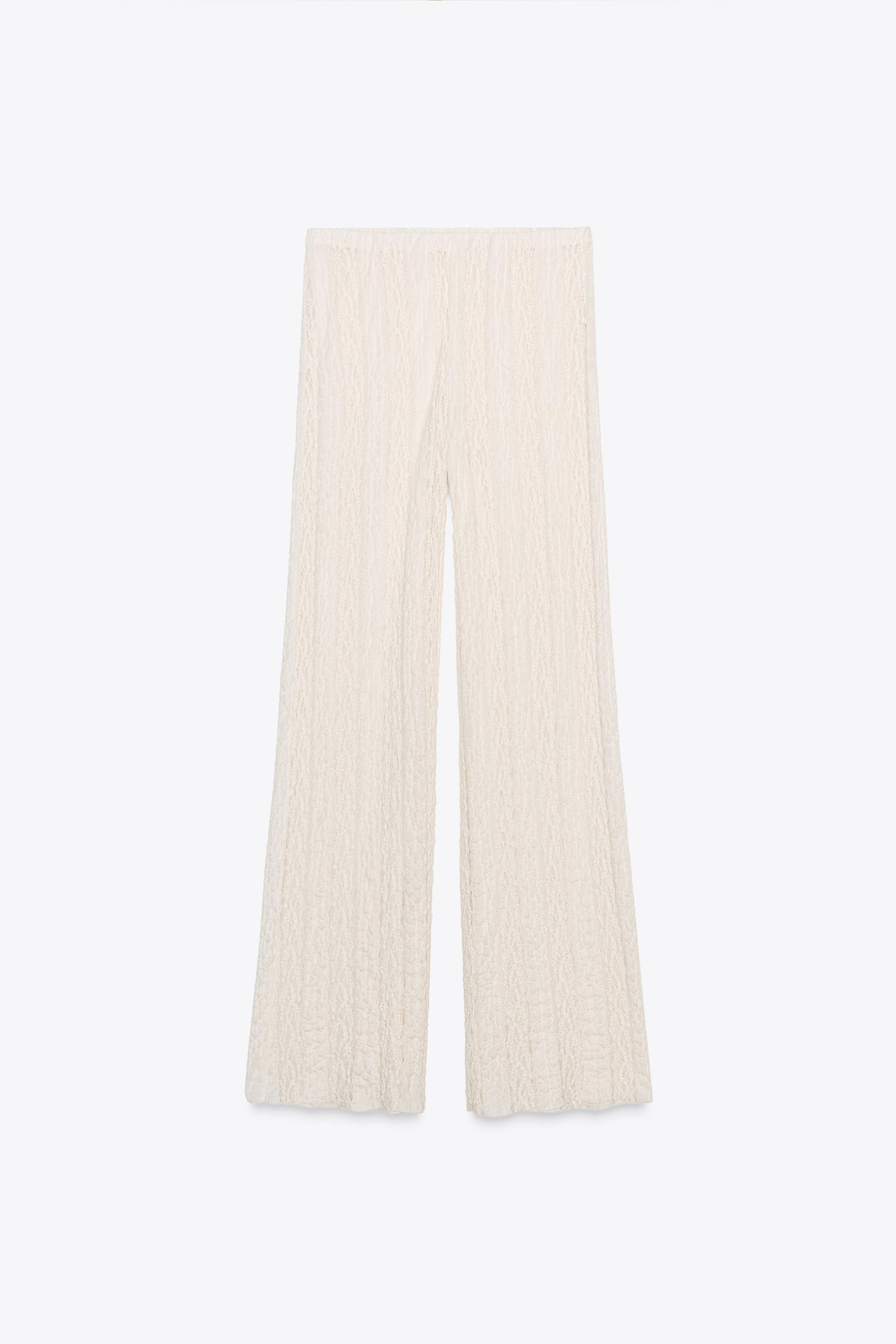 High-waisted pants with interior elastic waistband. Textured fabric with lace appliqué. Wide leg... | Zara US