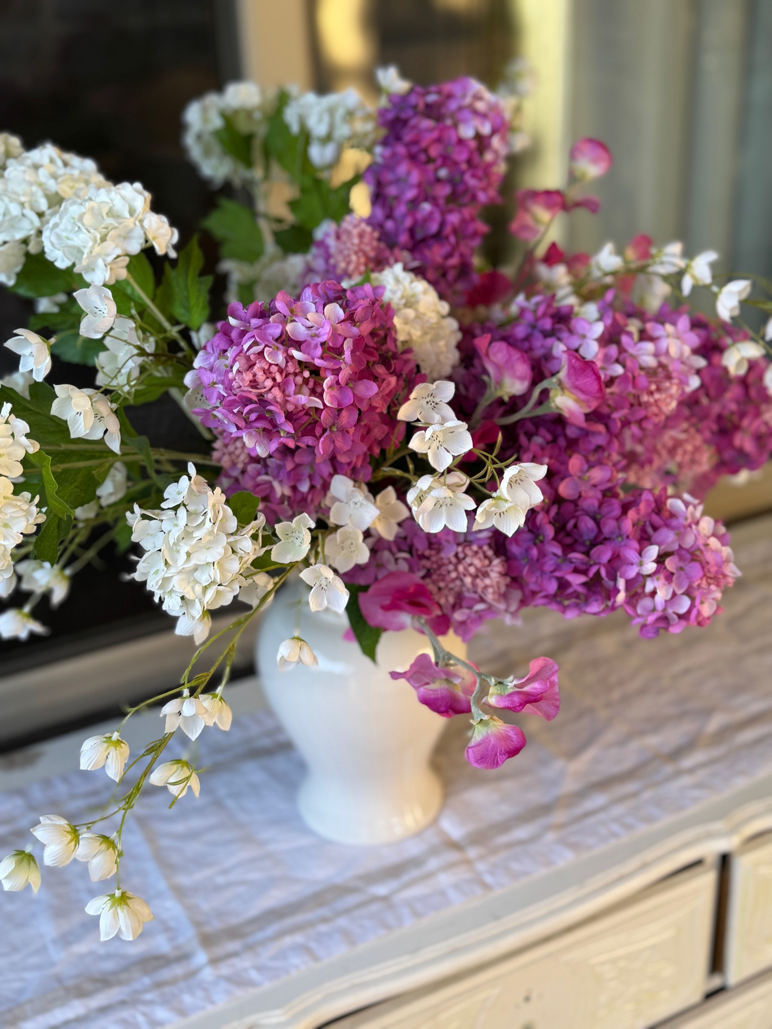 Cheerful real touch faux flowers. Love the color of these Panicle Hydrangea blooms! 

Faux flowers, hydrangea, spring flowers. flower arrangement 

#LTKHome #LTKFindsUnder50