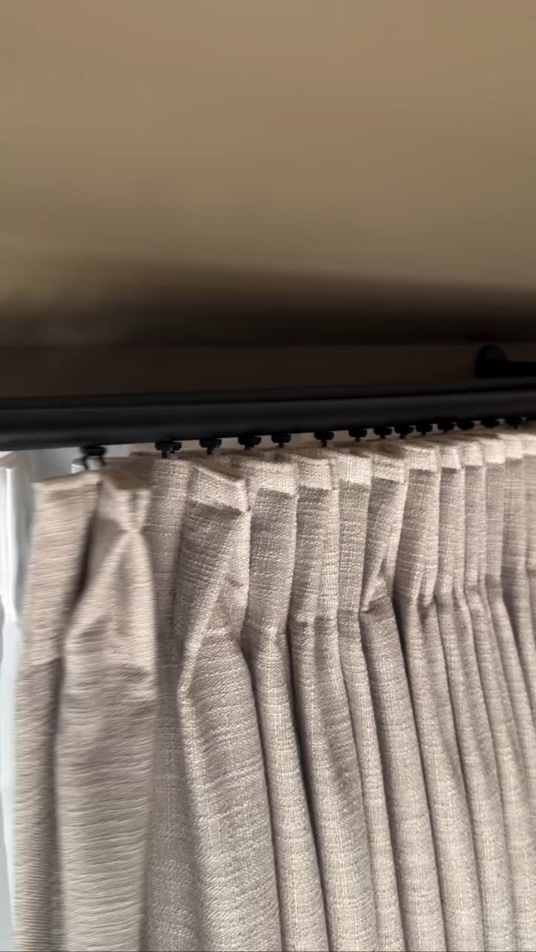 This rod truly changed the feel of our primary suite. 

It glides smoothly and quietly — no snagging, no pulling, just that effortless, hotel-style movement.

The double rod gives us the best of both worlds: soft sheers for daytime privacy and blackout panels for cozy nights — all without compromising the aesthetic.

I doubled the panel width for fullness, and the memory-trained pleats create the most beautiful, structured drape.

These curtains and rod from @twopageswindow are it. ✨

Save for reference: 
curtain rod is Gloria Double Traverse Rod
Black out curtains are Liz Linen Drape Pleated - color Burly wood Birch - tailor pleat
Sheer curtains are Scandina Solid Voile Sheer pleated curtain - color beige - pinch pleat