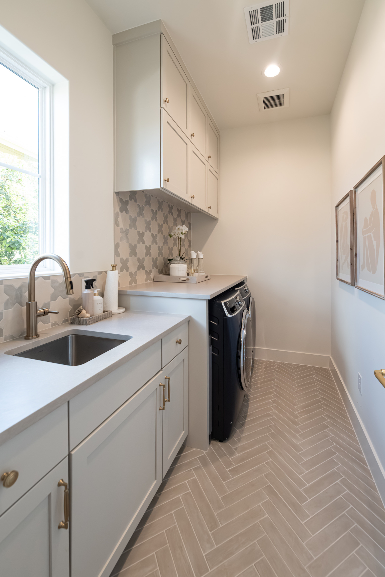 In Christina's home, the laundry room and mudroom sit at the center of daily movement.  Every element in this space was placed with intention, and even the smallest details are arranged to support seamless function.

#LTKmomlife #LTKHome