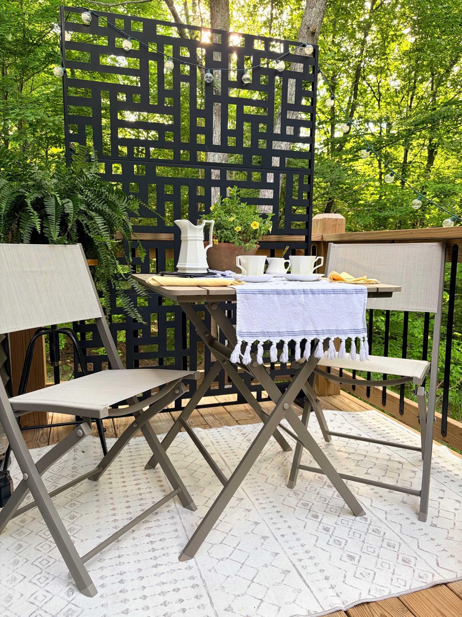 My summer morning coffee stop is everything. ☕🌿 
Light gray foldable bistro table and chairs, handmade planter with purple petunias, lemongrass, and a yellow rug — all from Wayfair. The perfect deck corner that folds away for storage when you need the space back. Shop everything linked below

#LTKmorningroutine #LTKdayinmylife #LTKHome