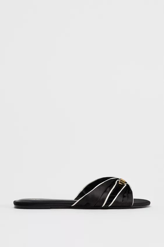 Satin finish flat sandals. Knot detail with metallic piece on the front. Flat sole. Rounded toe.S... | Zara US