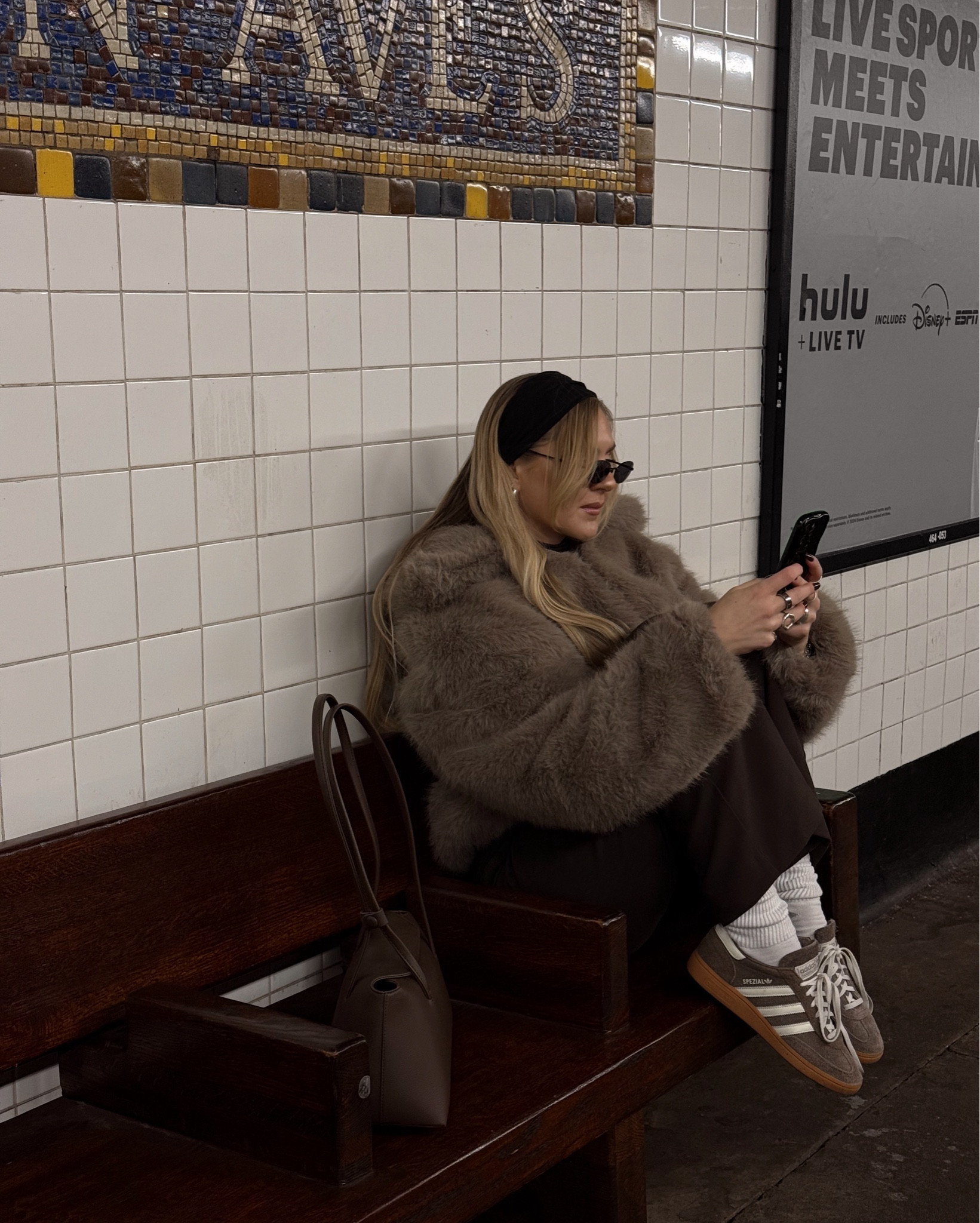 Beige fuzzy jacket and brown accents

#LTKStyleTip