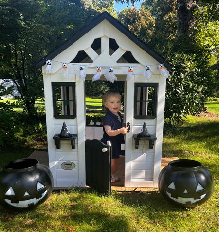 White playhouse with black shutters decorated for Halloween 

#LTKhome #LTKHalloween #LTKkids