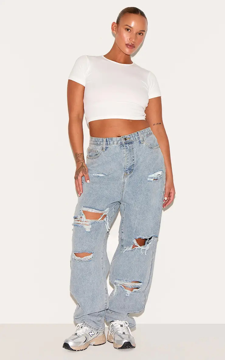 Light Blue Wash PRETTYLITTLETHING Plus Light Blue Wash Ripped Mom Jeans | PrettyLittleThing USA | PrettyLittleThing US