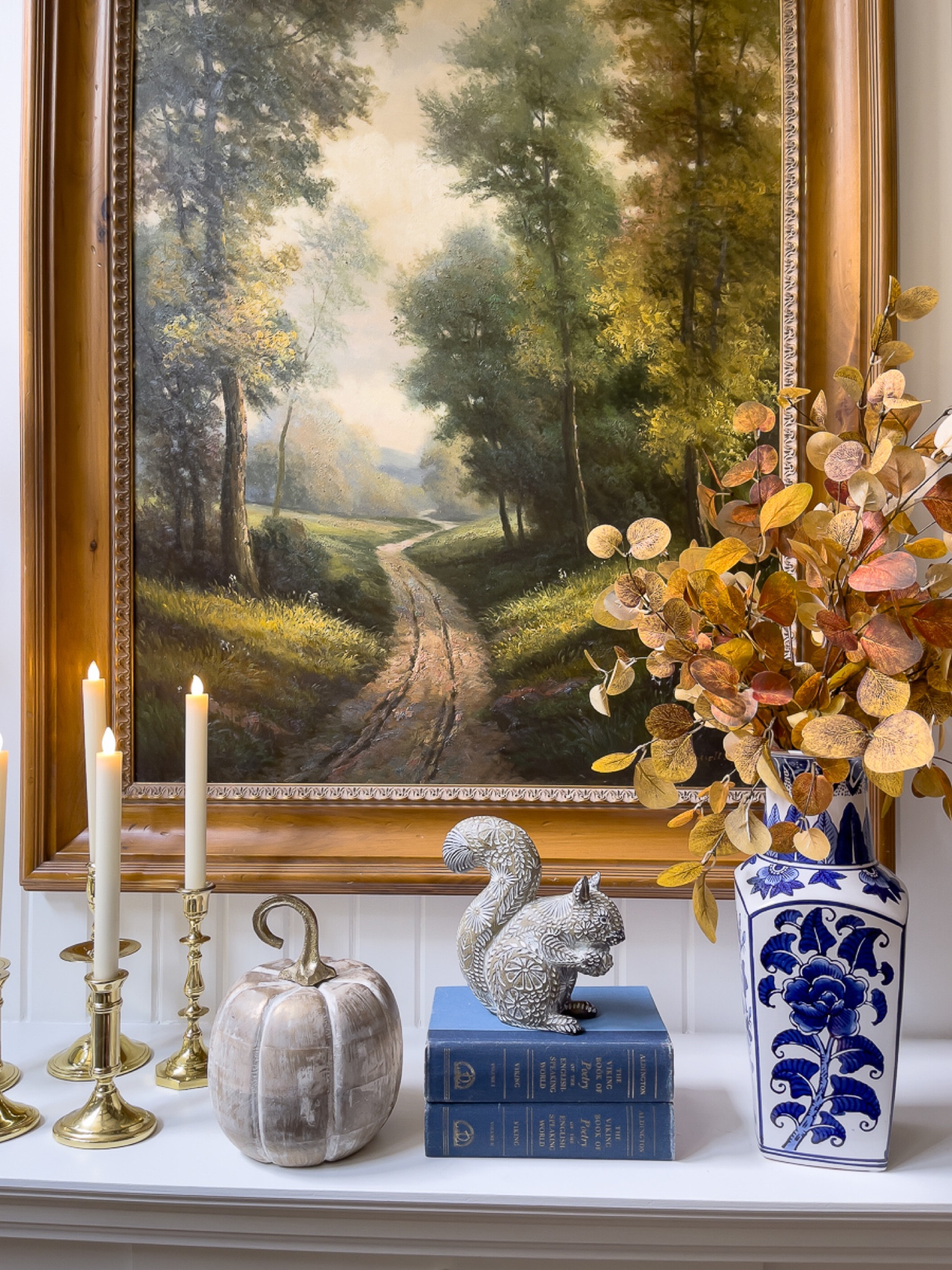 Brass and battery-operated candlelight is a perfect combination with my blue and white for the mantel this fall. #batteryoperatedcandles #chinoiserie #bluebooks #squirrel #brasscandlesticks #manteldecor #fallmantel

#LTKstyletip #LTKSeasonal #LTKhome