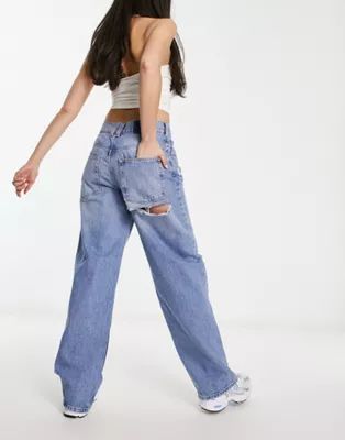 ASOS DESIGN baggy boyfriend jean in mid blue with cheeky rips | ASOS (Global)