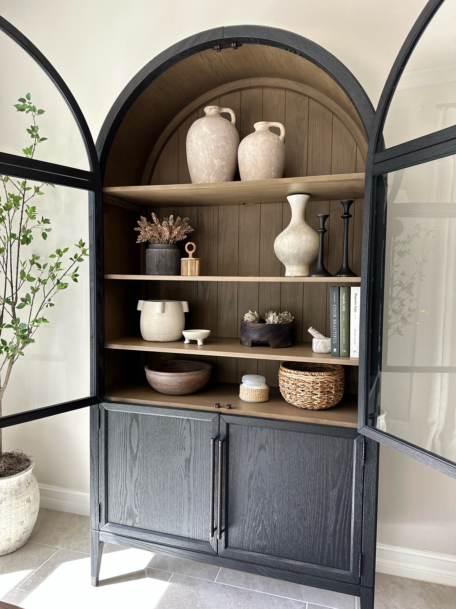 Shelf styling can be tricky. I like to stay within the same color family and I try to use a variety of textures. The real showstopper here is the cabinet.✨


Hattie cabinet, arhaus cabinet, pottery Barn vase, candle holder, crate and barrel, studio McGee, target basket, magnolia cookbook

#LTKunder50 #LTKhome