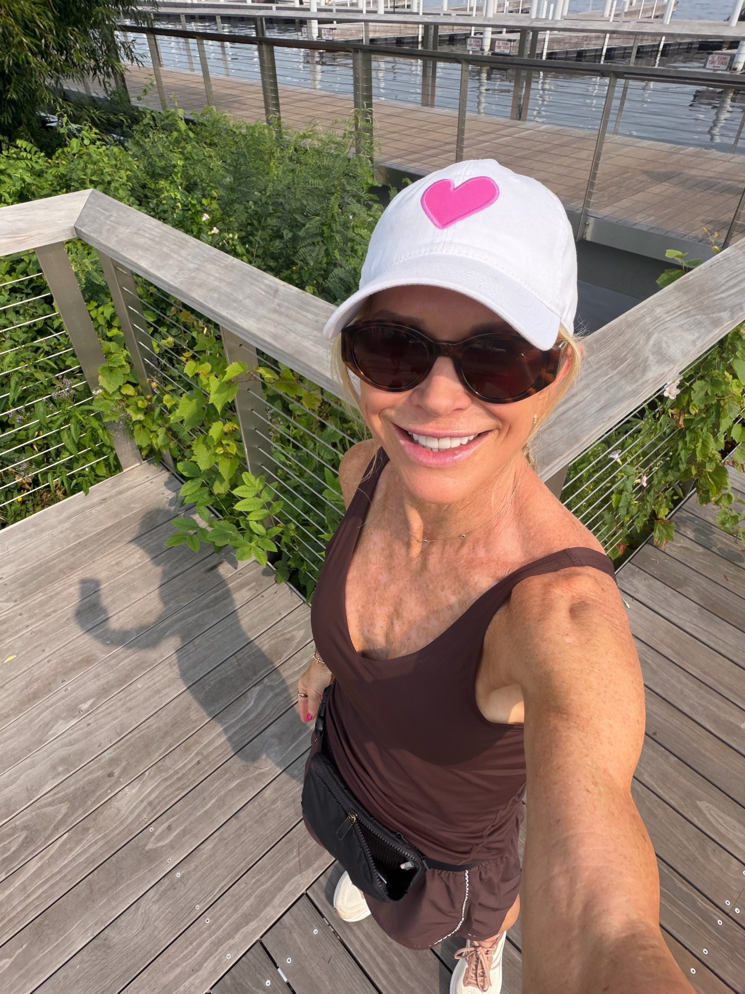 My walking outfit today!! I’m an athletic shorts connoisseur🤪. I love the lace detailing on these shorts and this is one of my favorite tops. It’s a little bit longer.!  I’m wearing a small in the shorts, but I size up to a medium in the top so it’s not skin tight

#LTKfitnessgoals #LTKActive #LTKOver40