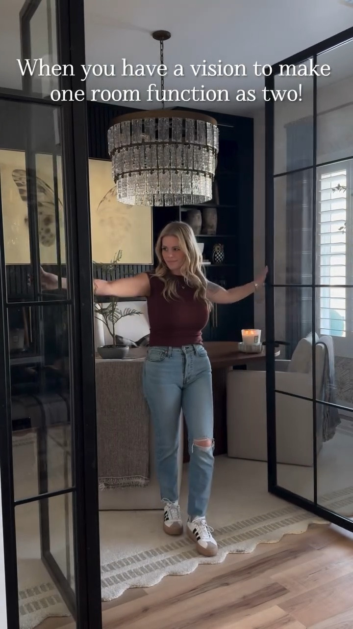 I had a vision for this space from the day we moved in! This is our formal dining room that we never used and I wanted to change that, so we made it function as two rooms in one!

We made custom built-in cabinets, put up wallpaper, installed metal and glass doors, and hung a statement piece chandelier from the Chevall Collection It is the true show stopper of the space to turn this room into our home office.

It stays like this 90% of the time but this room has a secret. My desk is actually a dining table. I love it because it’s more spacious and works for my needs but because of that this room can be flipped back into a formal dining room when needed by simply swapping the chairs. Who doesn’t love a multifunctional space, right?!?

This room is definitely one of my favorite spaces in our home that we have transformed and one that went from a hardly used space to one of our most used rooms!

#homeoffice #diy #diyprojects 

#LTKHome