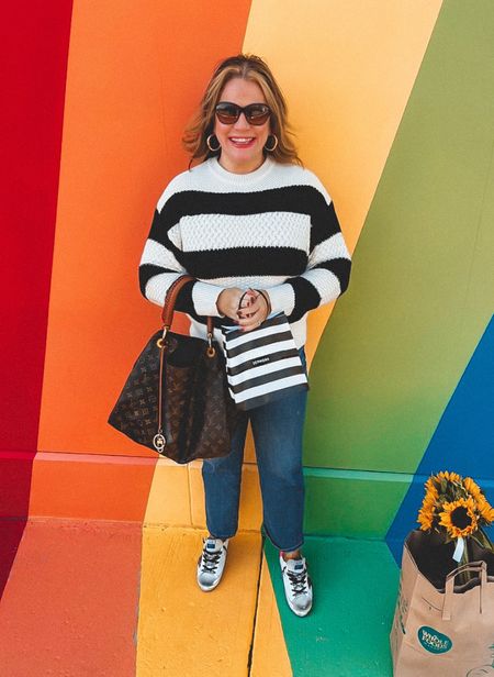 This picture makes me think of “Fruit stripes gum” from back in the day! Does else remember that stuff?
I’ve always loved anything with black and white stripes, this sweater is no exception. It’s light enough in weight to wear now. It will be ideal to layer over a cozy flannel once it gets cooler. 
Oh abs did I forget to mention… it’s on sale for only $20.00!!!

#LTKSeasonal #LTKunder50 #LTKsalealert