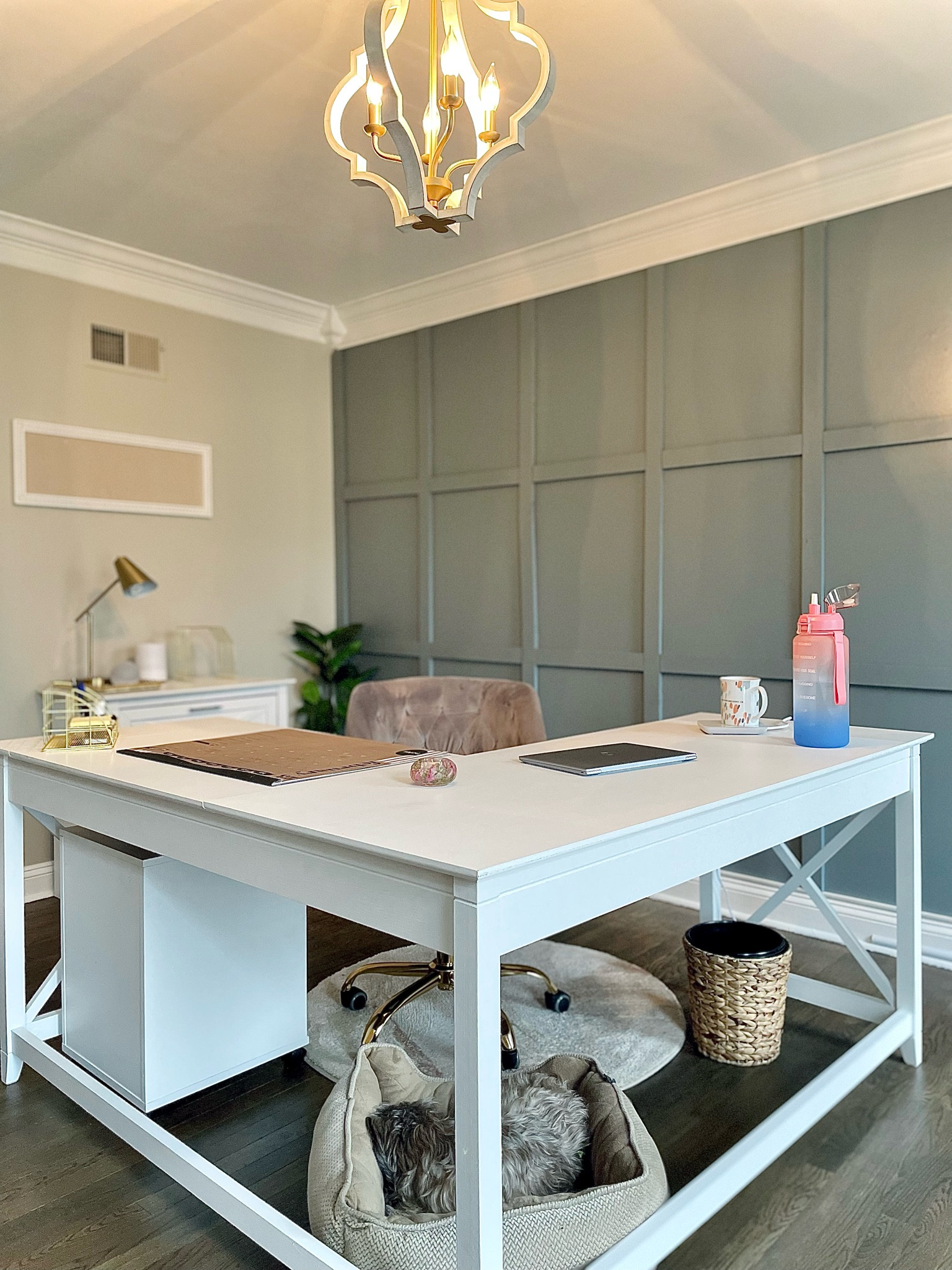 Board and batten accent wall 🤍 Modern farmhouse home office with gold accents ⚱️

Gold wire baskets
Gold desktop file holder
Coffee warmer
Gold and white chandelier
Desktop calendar
Farmhouse desk
Farmhouse filing cabinet
Gold lamp
Water hyacinth waste bin