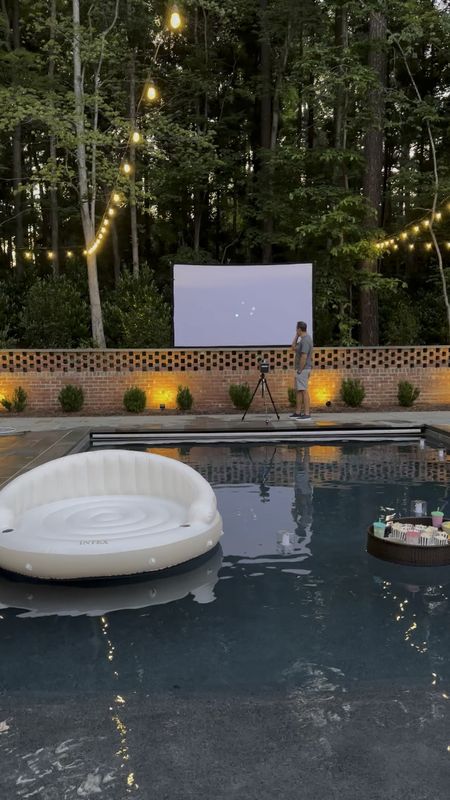 Last step of setting up the pool movie night was firing up the projector! The projector Chris chose is easy to set up for outdoor movies and is a smart projector with Netflix and other streaming platforms built in. Definitely an investment but worth it imo!

#LTKVideo #LTKFamily #LTKParties