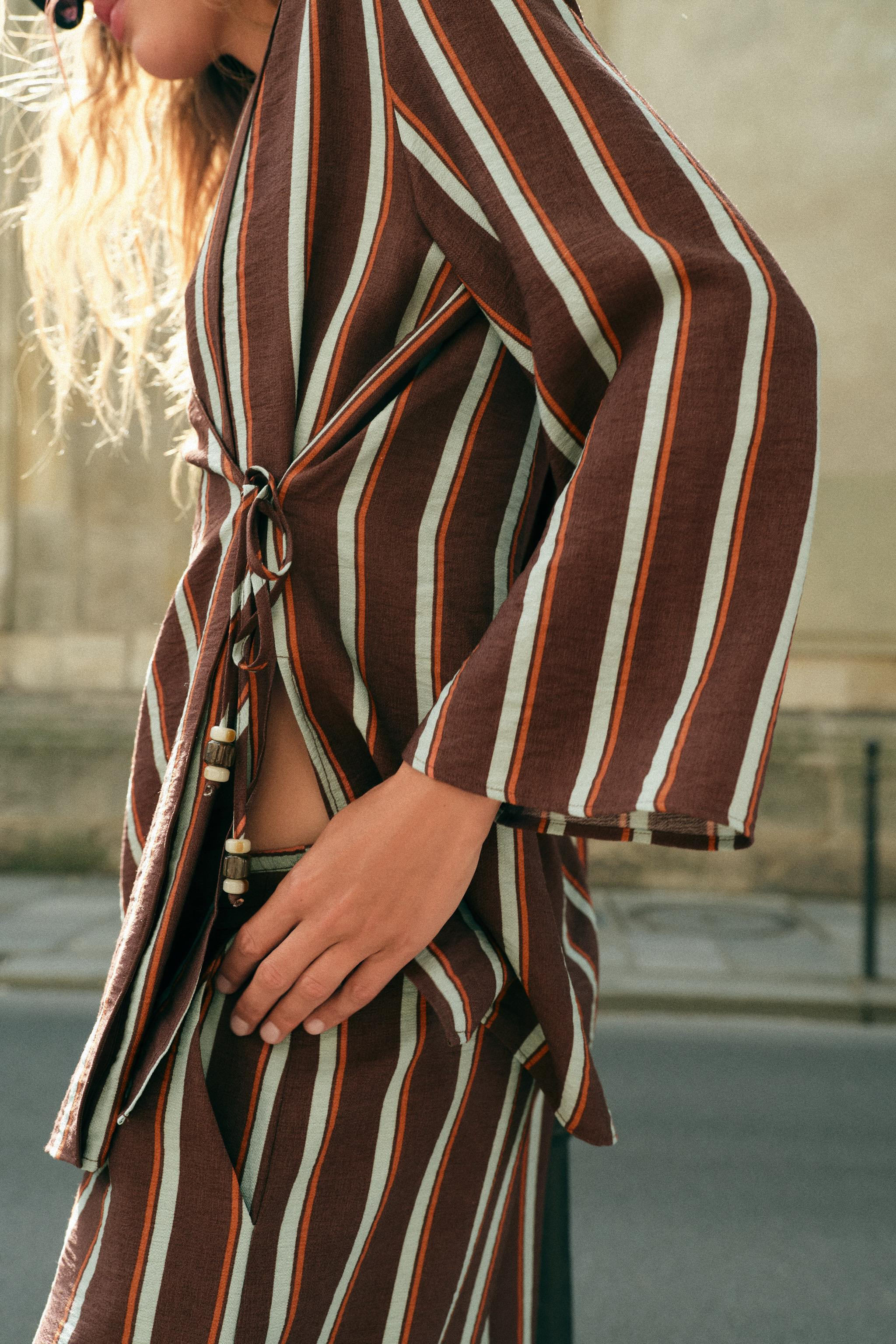 Long sleeve jacket with side vents at the hem. Front wrap closure with beaded ties. | Zara US