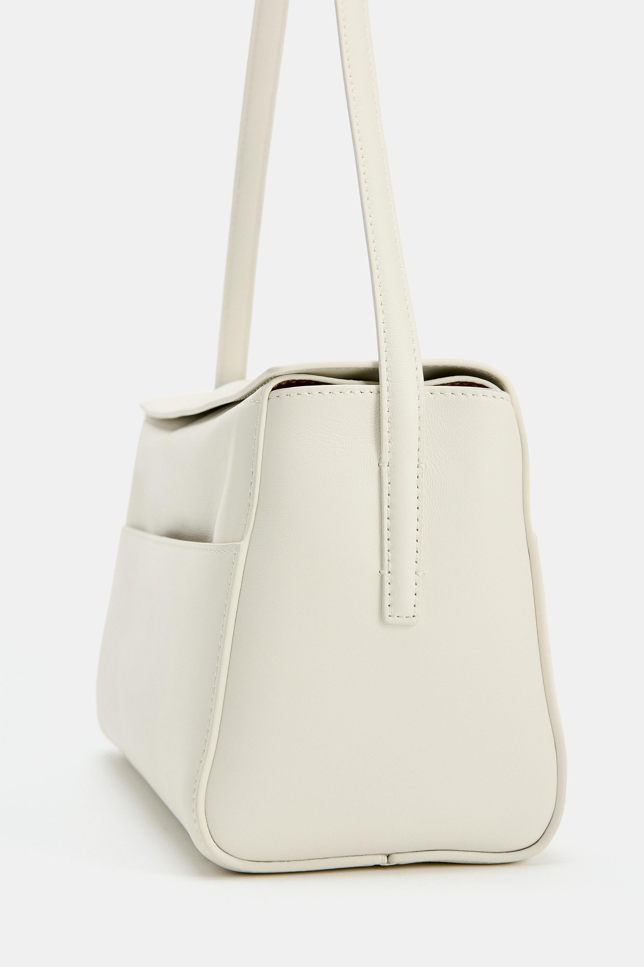 Leather shoulder bag. Topstitched detail on the body. Contrasting colour interior. Shoulder strap... | Zara UK