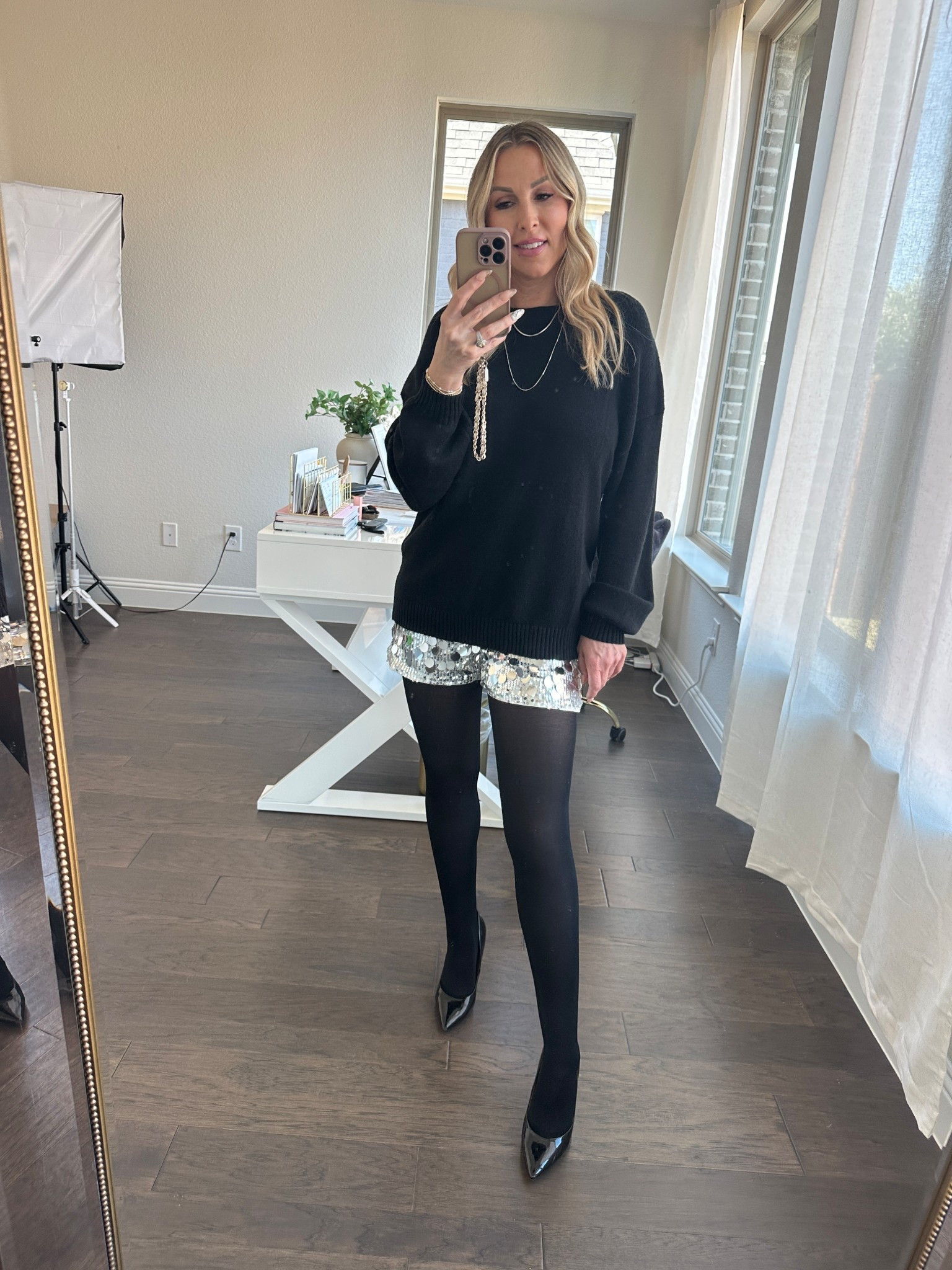 New Year’s Eve outfit idea that proves you don’t need a full sequin dress to feel festive ✨

These sparkle shorts are such a chic alternative for NYE — styled with an oversized black sweater and sheer tights for a look that feels elevated, comfortable, and confident. This is my go-to formula for holiday parties, dinner plans, or ringing in the new year in something effortless but still special.

If you’re searching for New Year’s Eve outfits that are classy, flattering, and wearable, this one checks every box.

#newyearseveoutfit #nyeoutfitideas #over40style #elevatedbasics #holidaypartyoutfit #chicstyle #highlowstyle #effortlessfashion