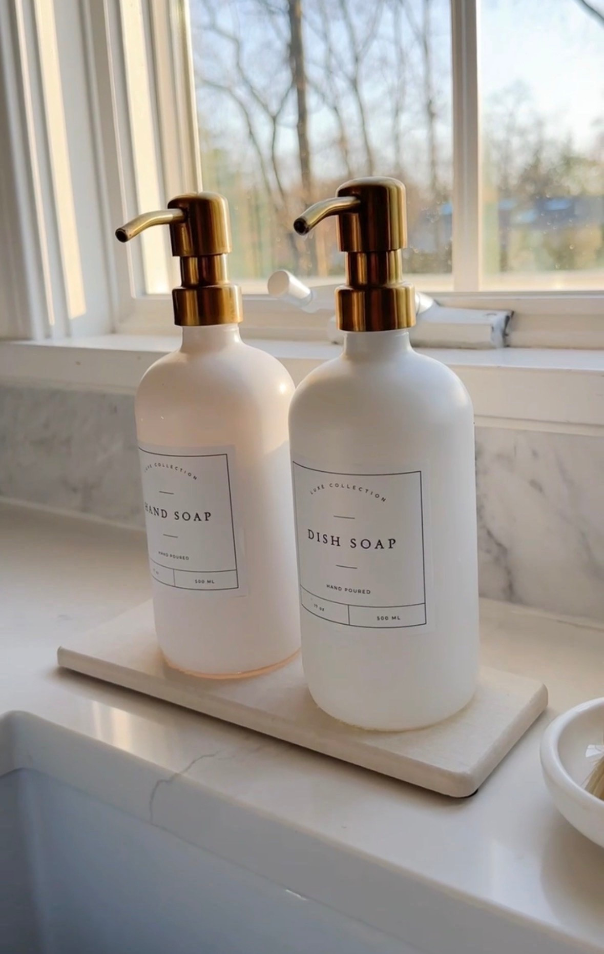 These kitchen soap dispensers and stone drying mat will instantly upgrade your sink area. I love the look of the brass but the ones I linked also come in silver and black!

#LTKHome